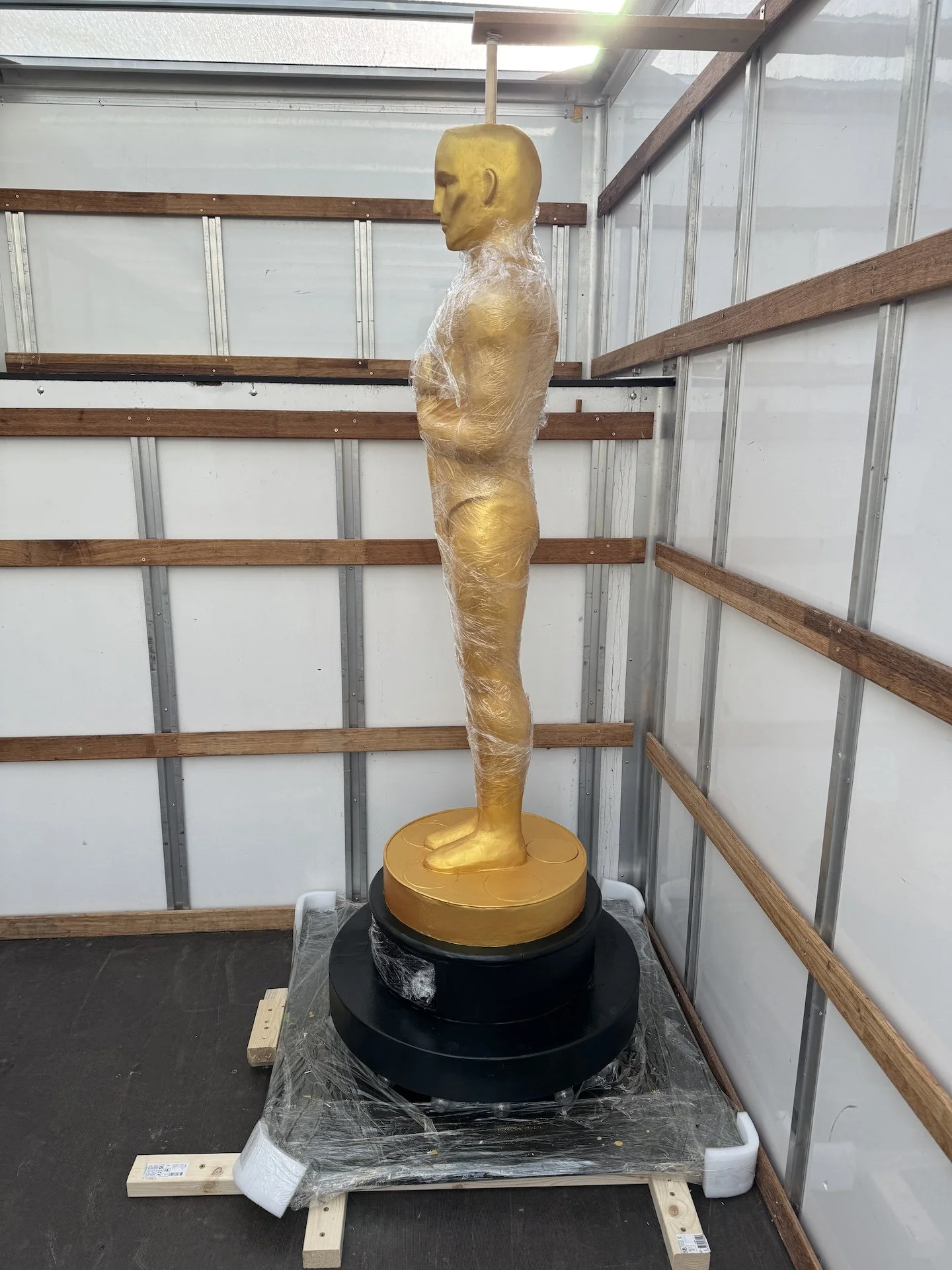 Transporting Gold Oscar Cake in a Van