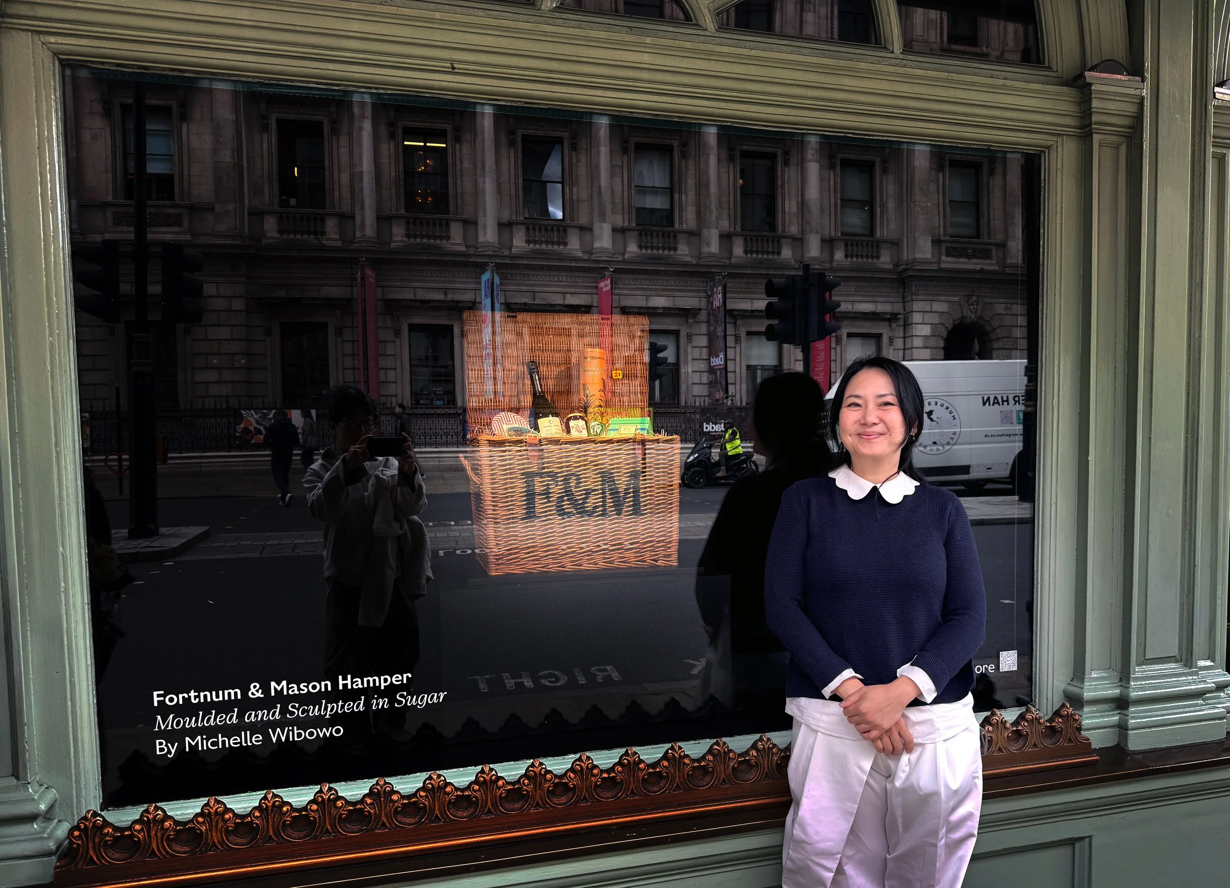 Michelle Wibowo pose in front of her creation The Fortnum & Mason's iconic hamper in Sugar