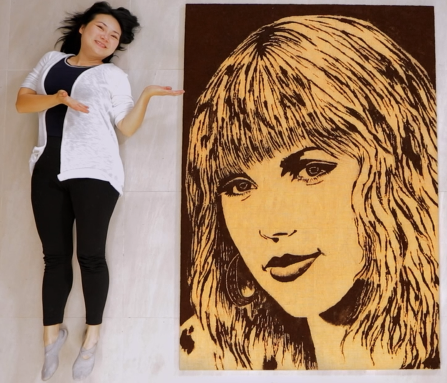 Food Artist Michelle Wibowo alongside her creation Taylor Swift Portrait from Coffee Grounds