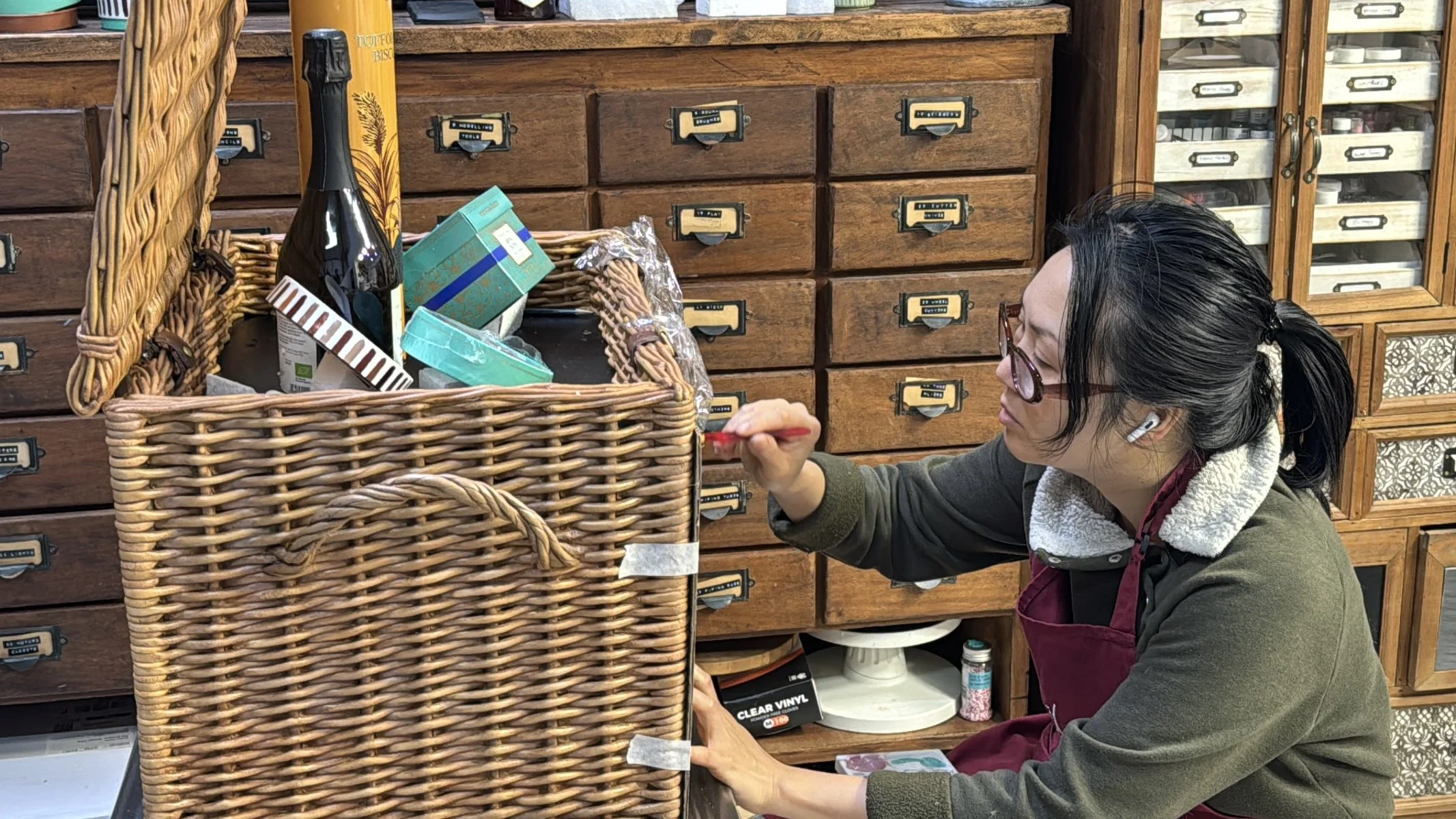 Food Artist Michelle Wibowo applying finishing touches to the Fortnum & Mason sugar hamper