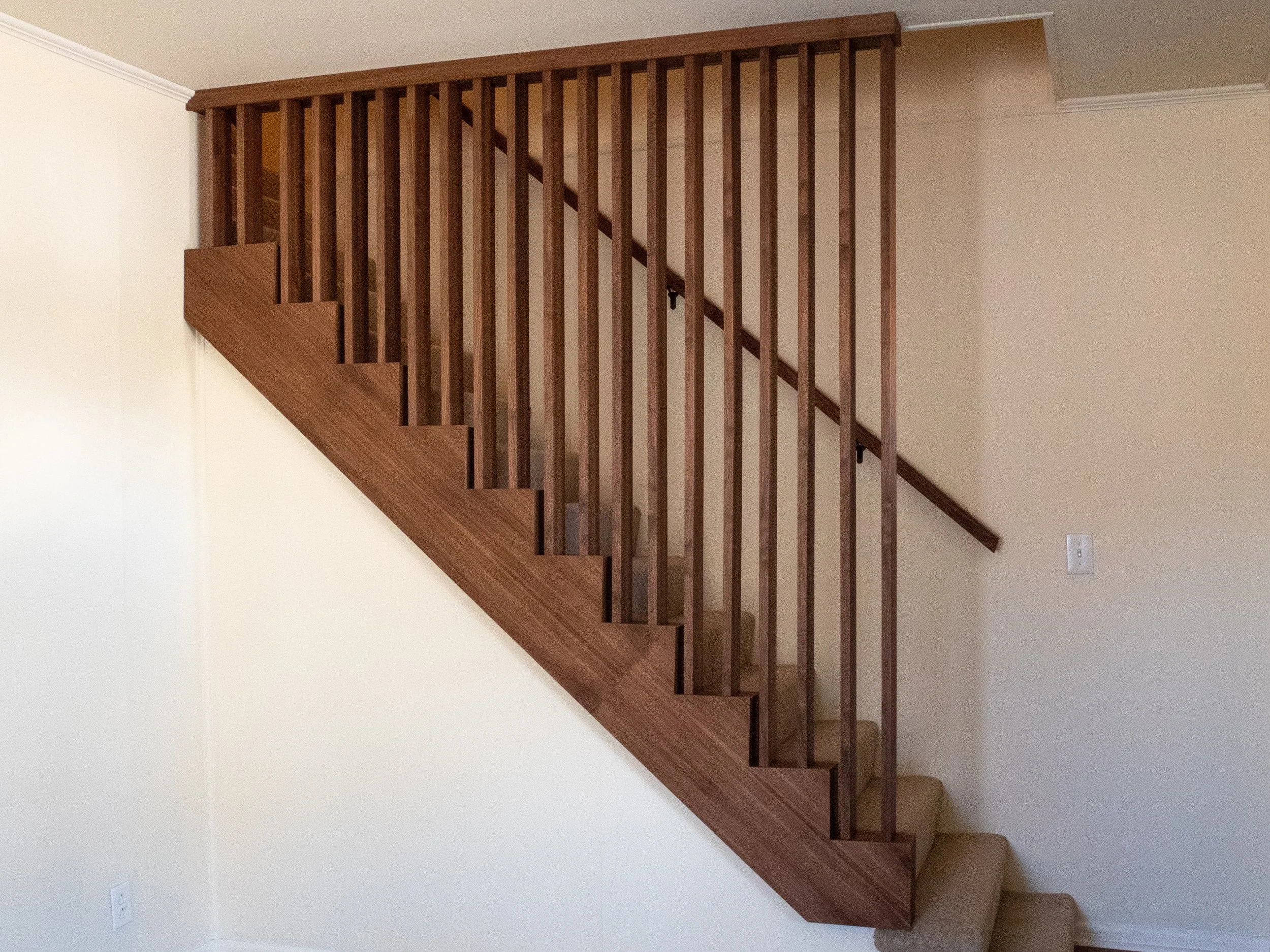 Love these Walnut slats. They transform the space.