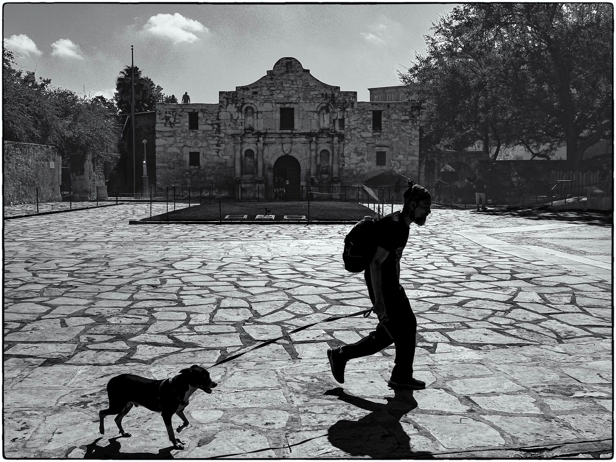A weary trudge across Alamo Plaza.jpg