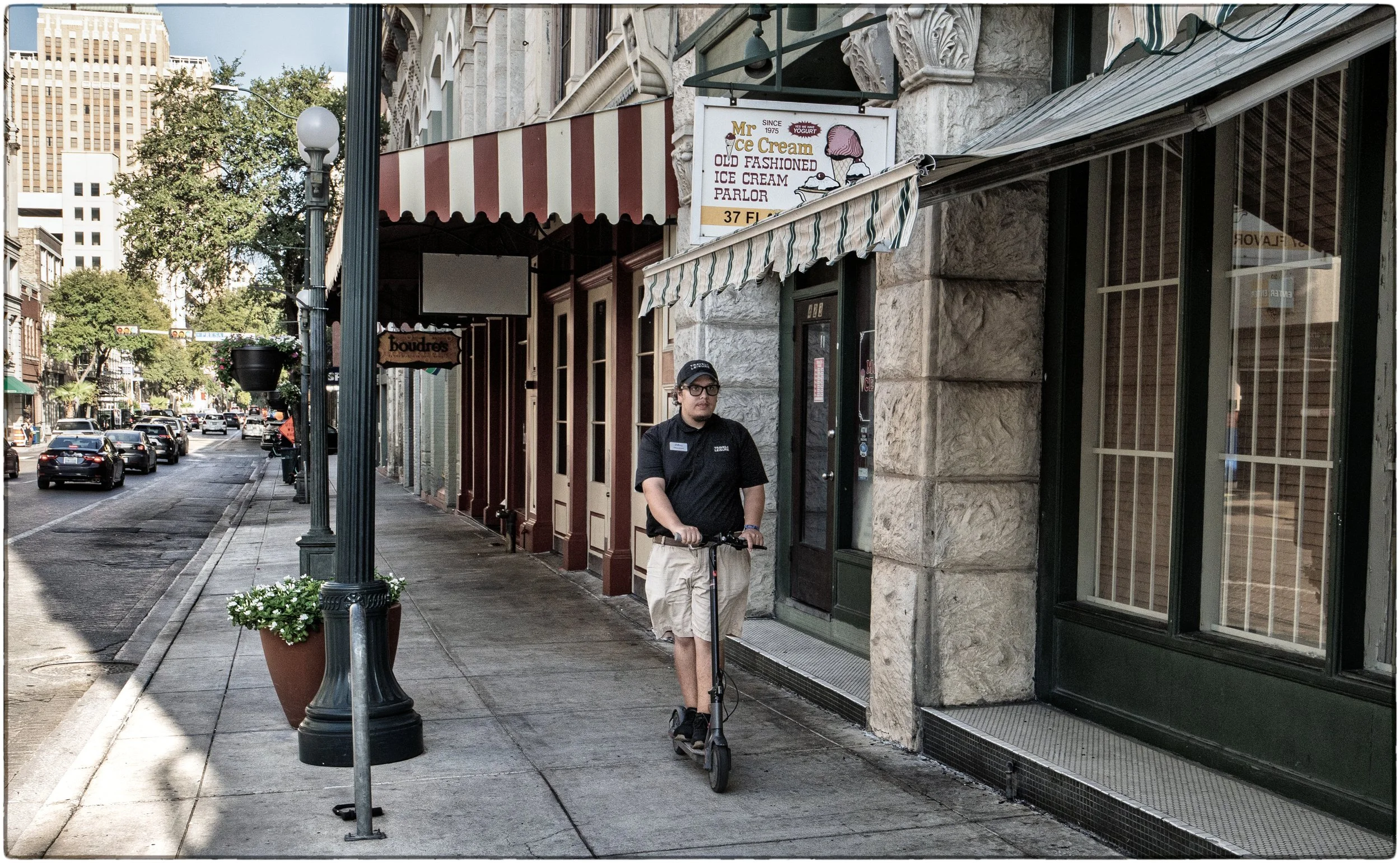 Scooting along Commerce Street in downtown San Antonio.jpg