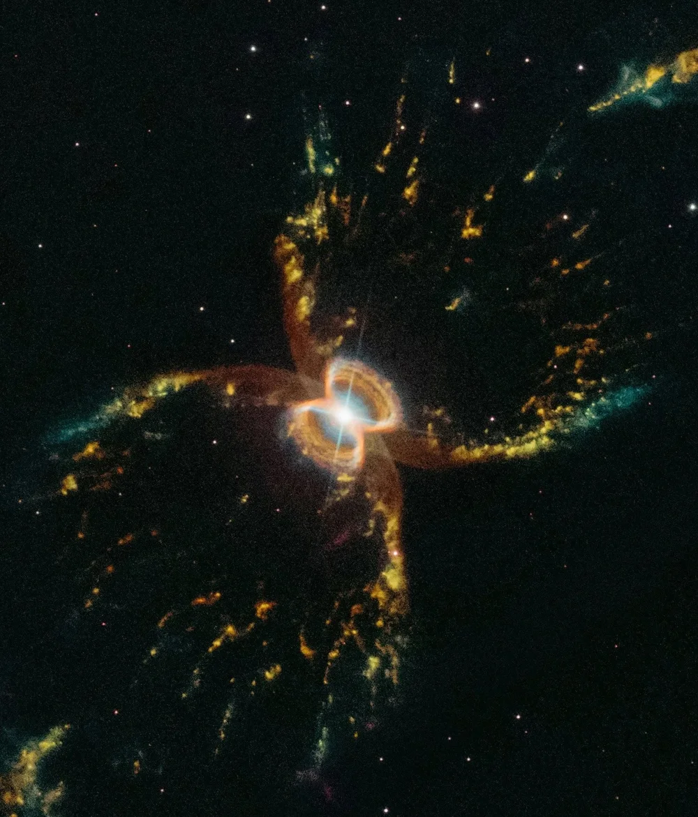 A glowing nebula with golden streams of light
