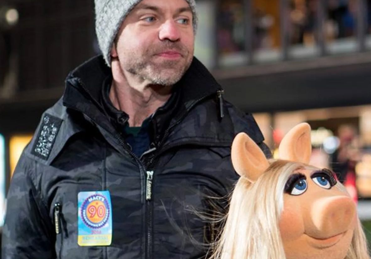 Wesley Whatley stands with Miss Piggy