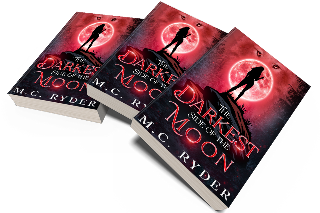 Three copies of a paperback book titled 'The Darkest Side of the Moon' by M.C. Ryder, arranged in a fan shape. The cover features a silhouette of a person standing on a small hill or mound, with a large red moon in the background, surrounded by a dark, ominous sky and eye-like shapes.