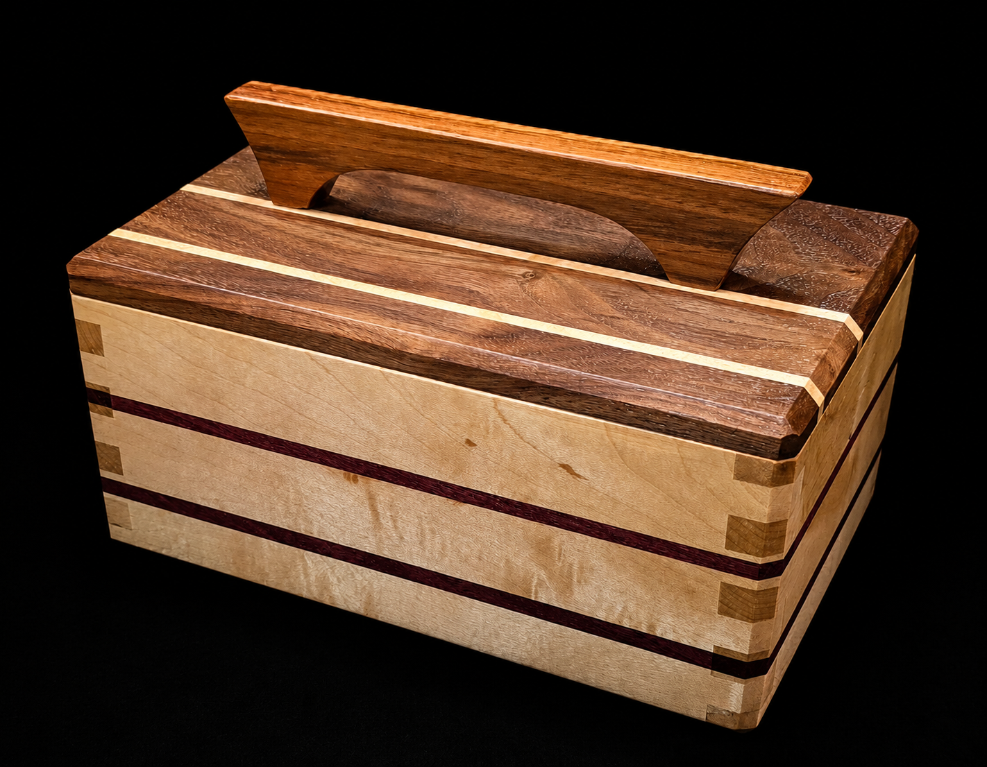 A wooden tissue box cover with a rectangular shape, intricate wood grain patterns, and a tissue slot on top, set against a black background.