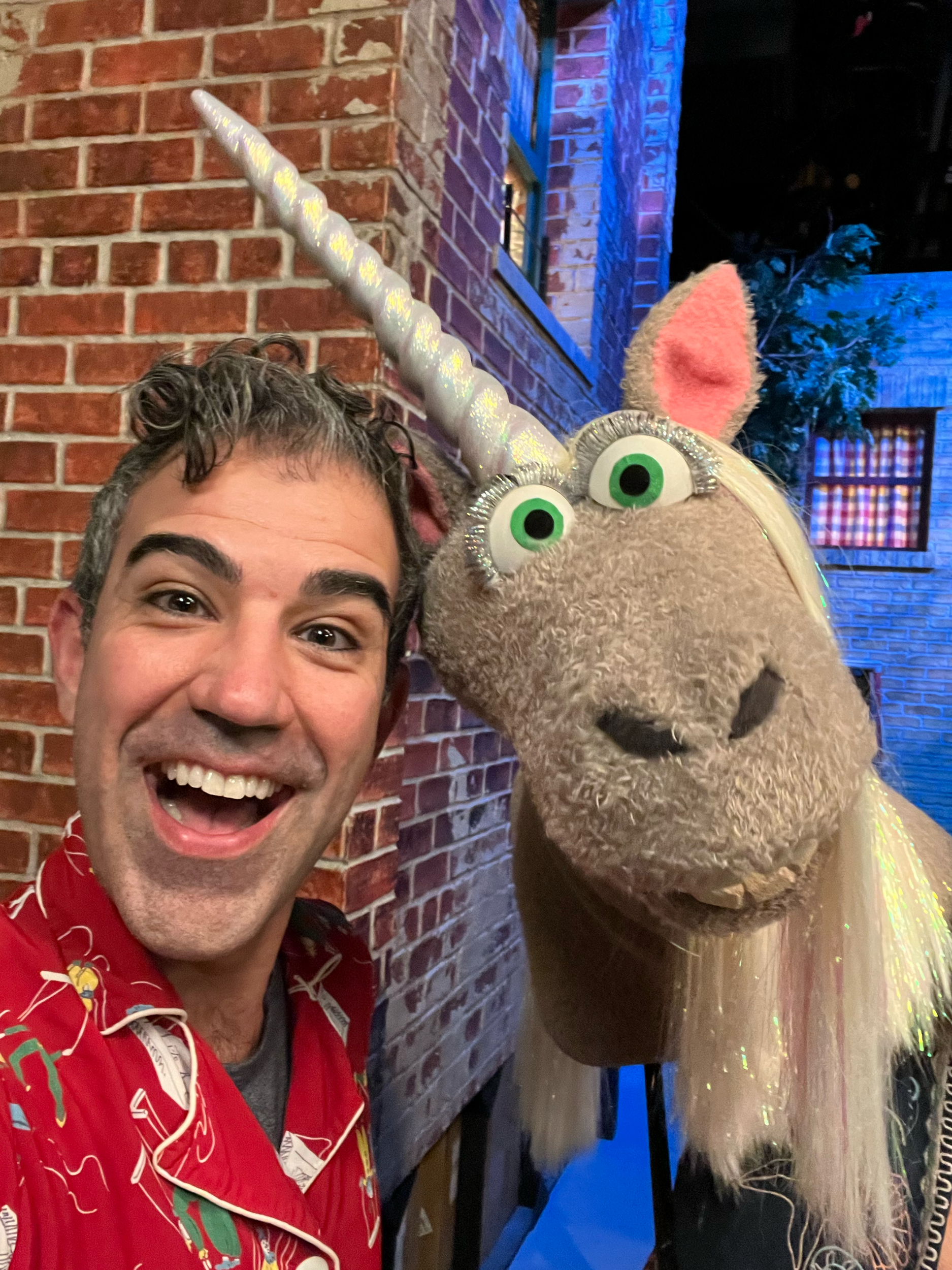 On set at Sesame Street - Emmy nominated Puppet wrangler Joshua Holden with A unicorn Muppet