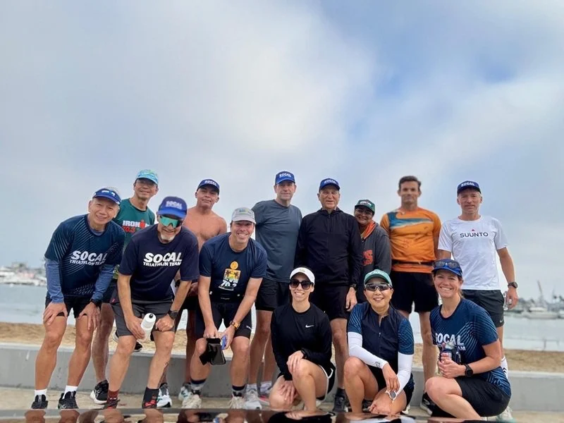 Group photo of Irvine Triathlon Team during a training run along Balboa Peninsula in Orange County, California.
