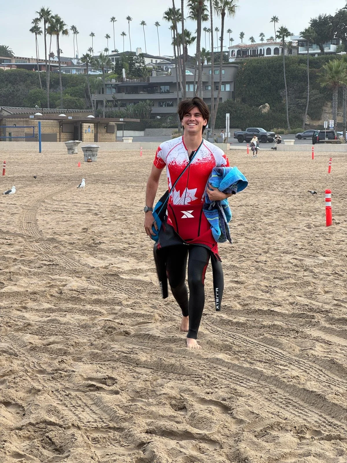 Photo of Triathlon Team from Irvine, Orange County - Josh (just) making it to the start of a Sunday ocean swim training session
