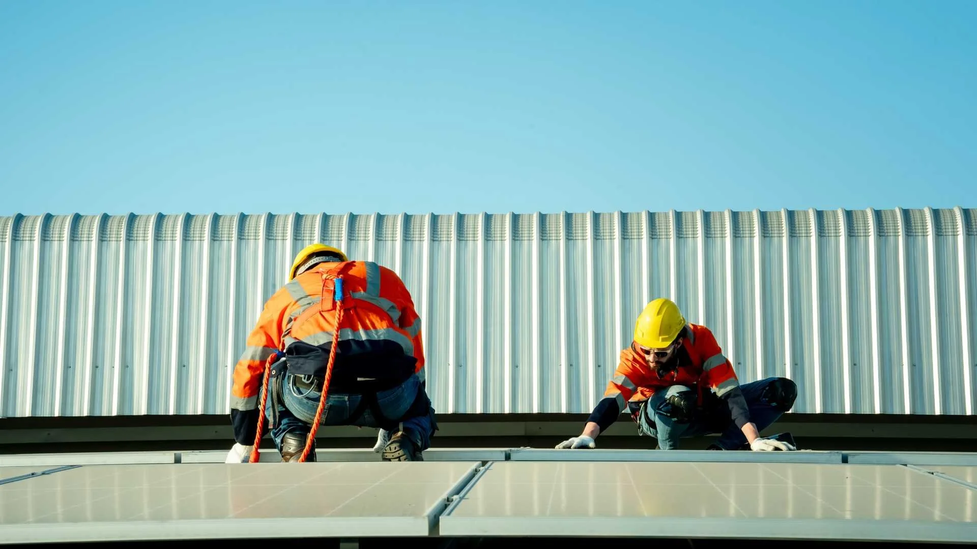 two roofers from the commercial roofing industry inspecting a commercial roof