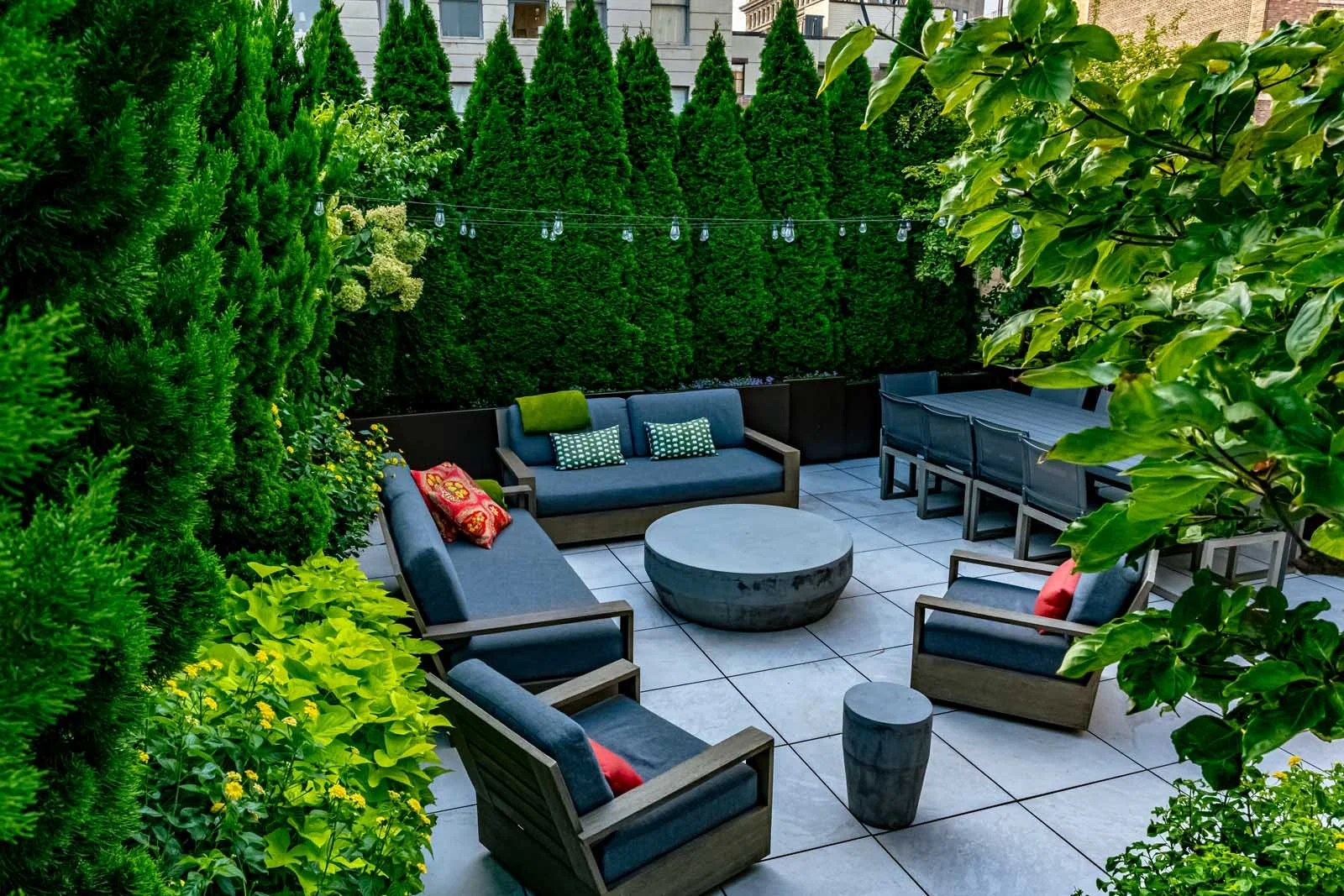 NYC rooftop patio with outdoor seating and fire pit area