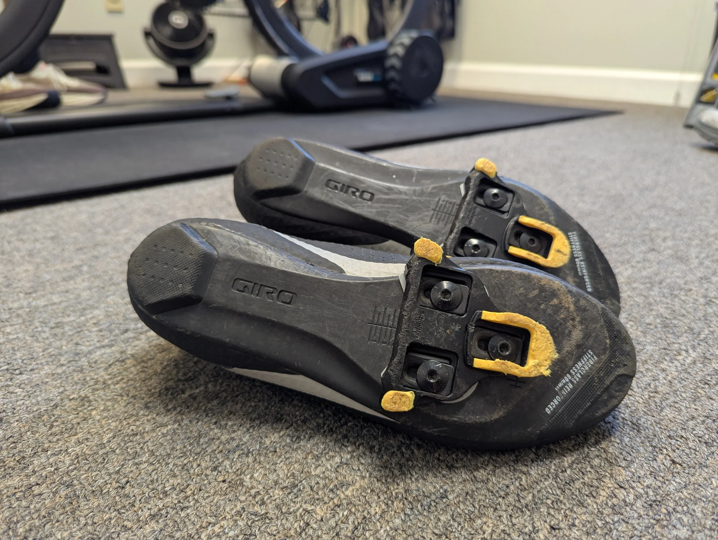 Bottom of cycling shoes showing the cleat setup