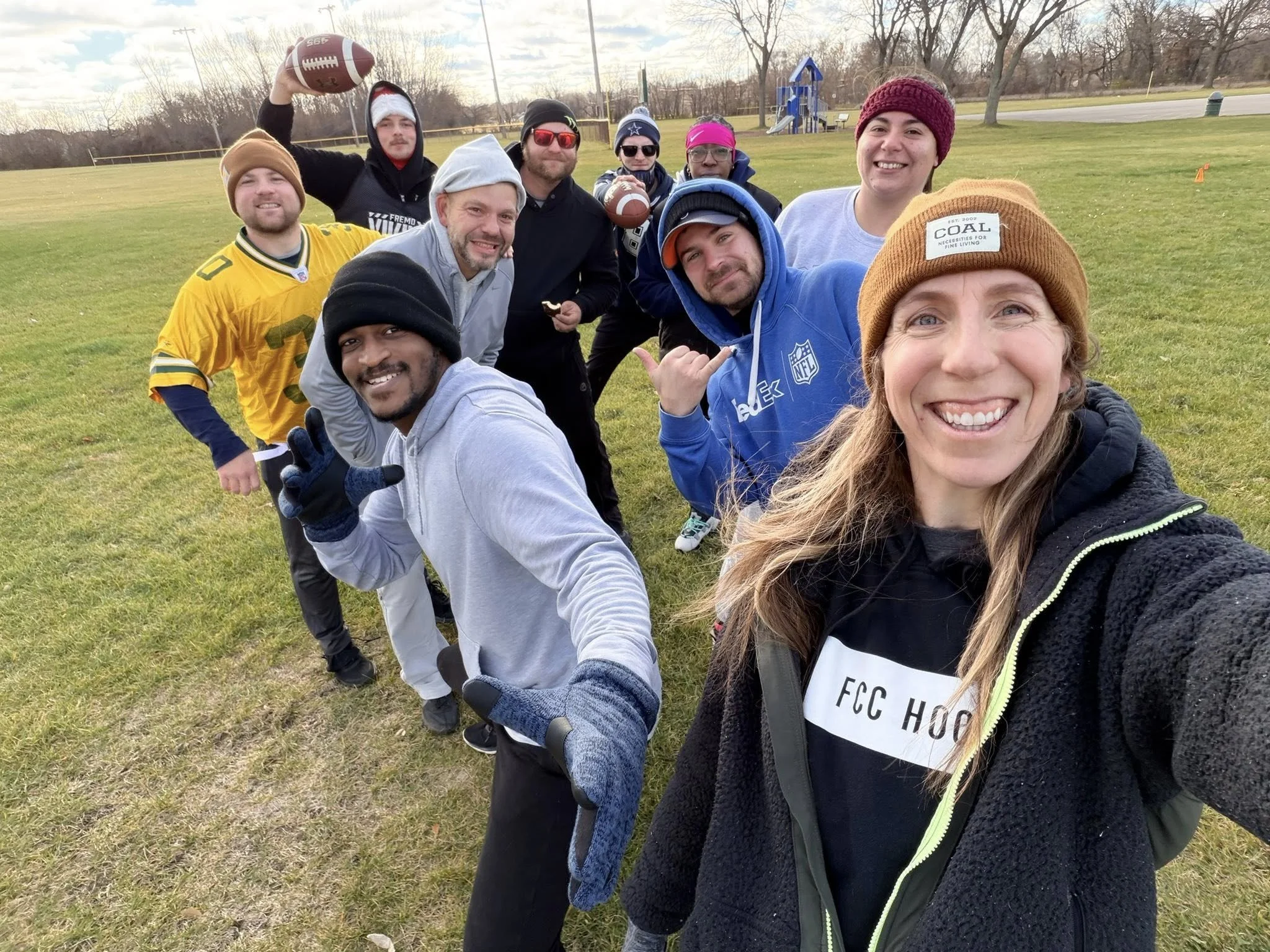 People playing basketball in an indoor gym.