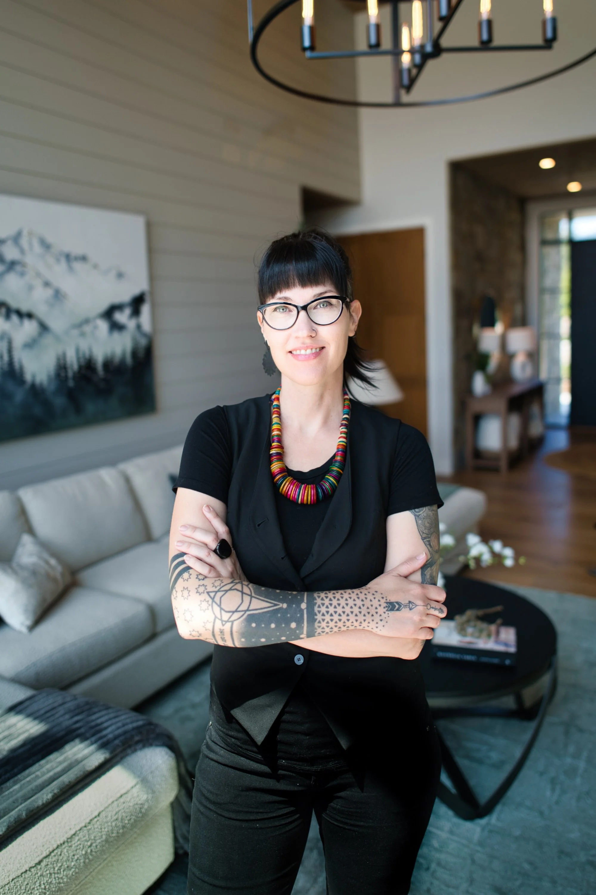 Elizabeth Pratt, a BCIT Certified Interior Designer in Chilliwack, BC, smiling in a modern interior setting