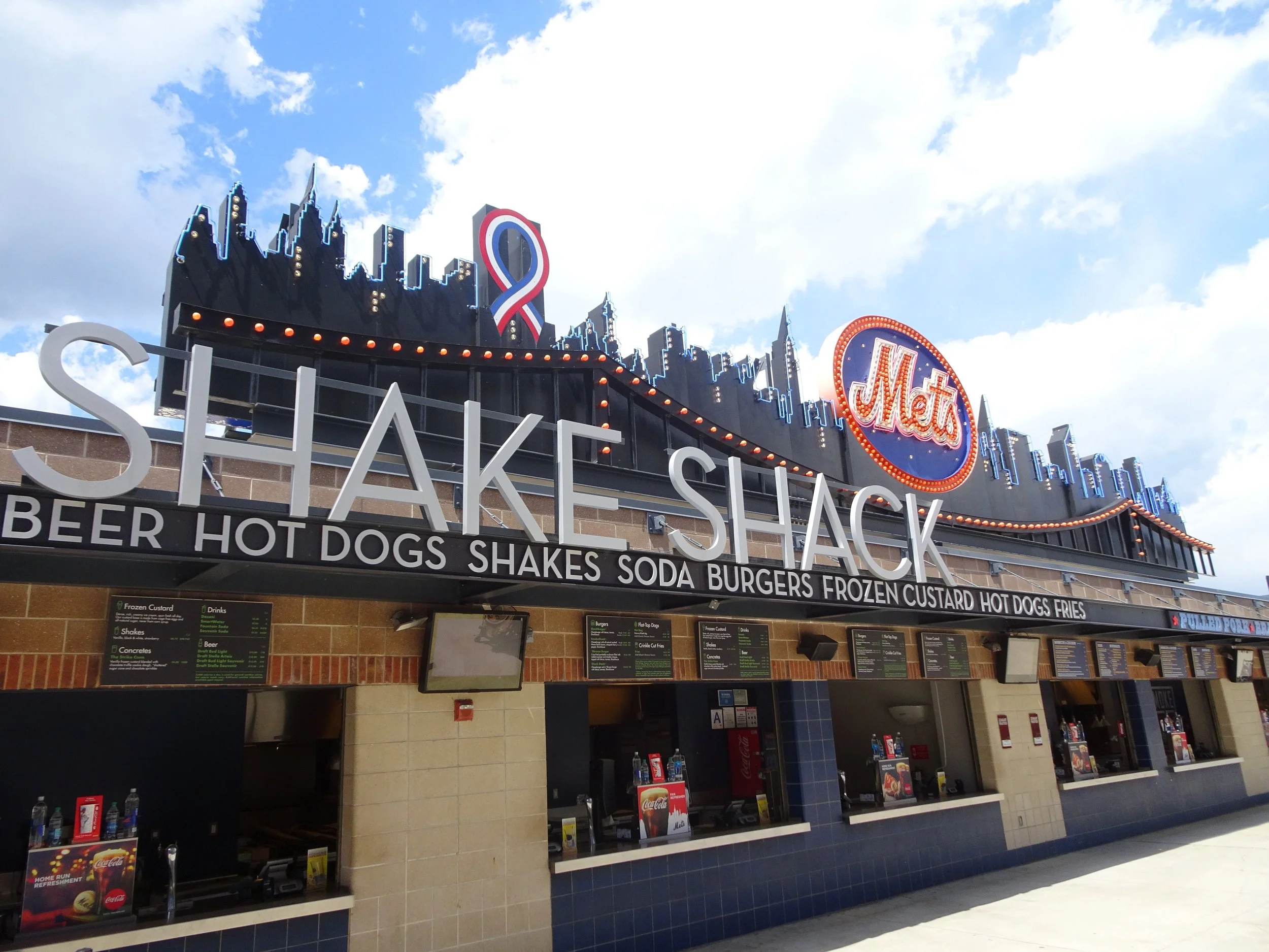 Fancy Food – Food and flair! Fans see a fancy NYC skyline display as they grab a shake or sandwich as they walk the outfield concourse!