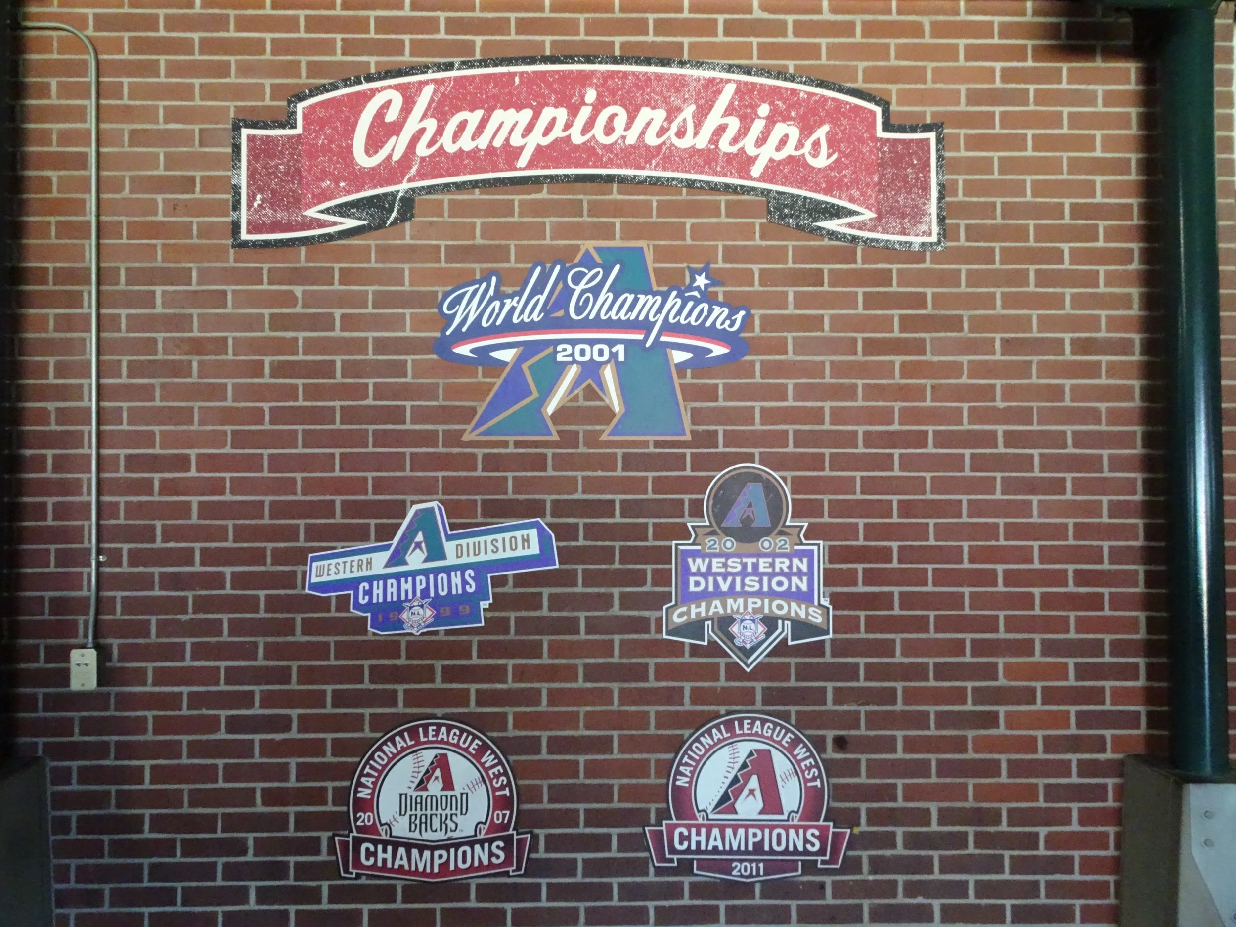 The Accomplishments – Hanging in left centerfield are the accomplishments of the Diamondbacks, who, along with the Tampa Bay Rays, is Major League Baseball’s newest franchise.