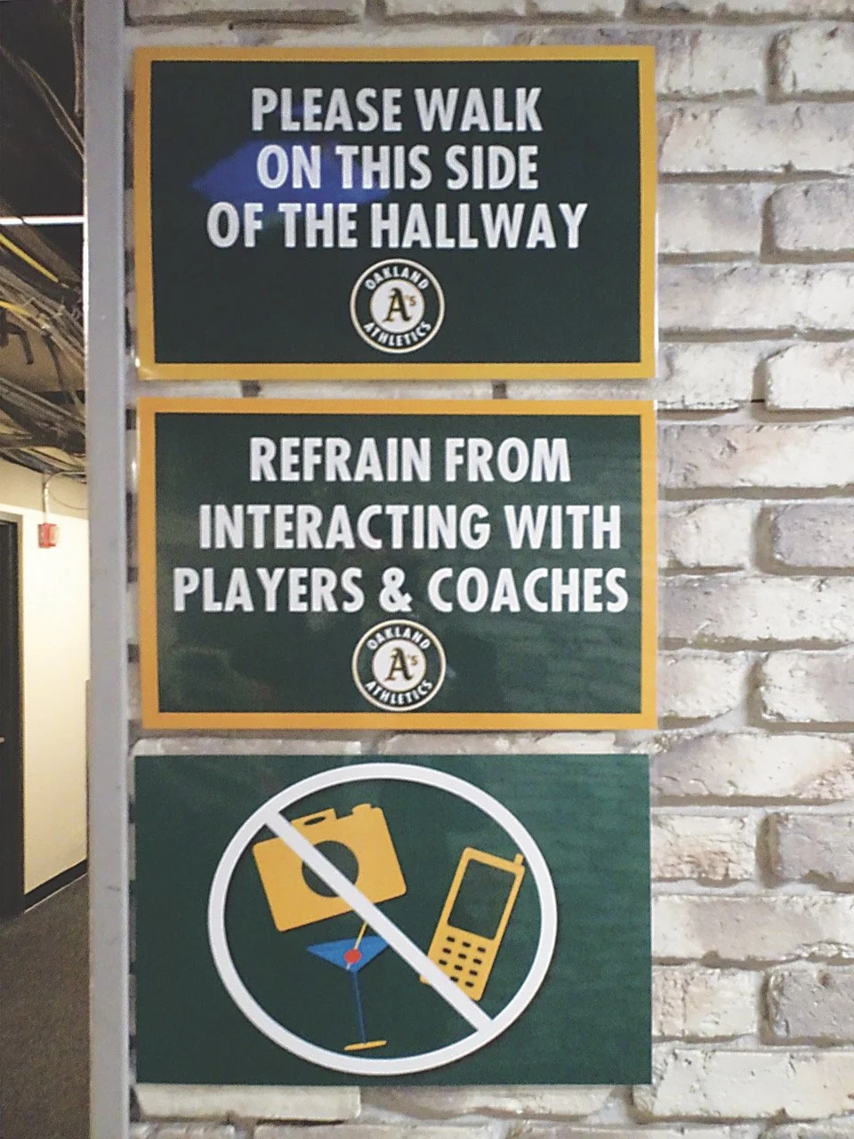  Walk This Way! – Fans were greeted with this sign as they made their way to the, assumedly, most expensive seats in the house, reminding them to behave, despite being just inches away from the visiting clubhouse!&nbsp; 