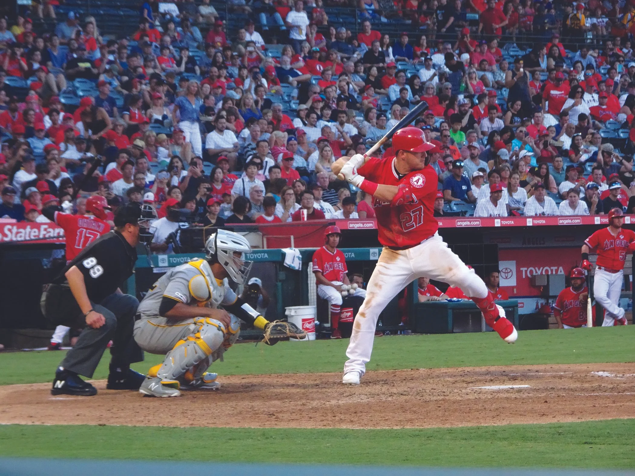  The Two Biggest SoCal Baseball Stars – Mike Trout begins to swing at a pitch during an August, 2019 game against the Pirates as arguably the only superstar bigger than him waits on deck – Shohei Ohtani. 