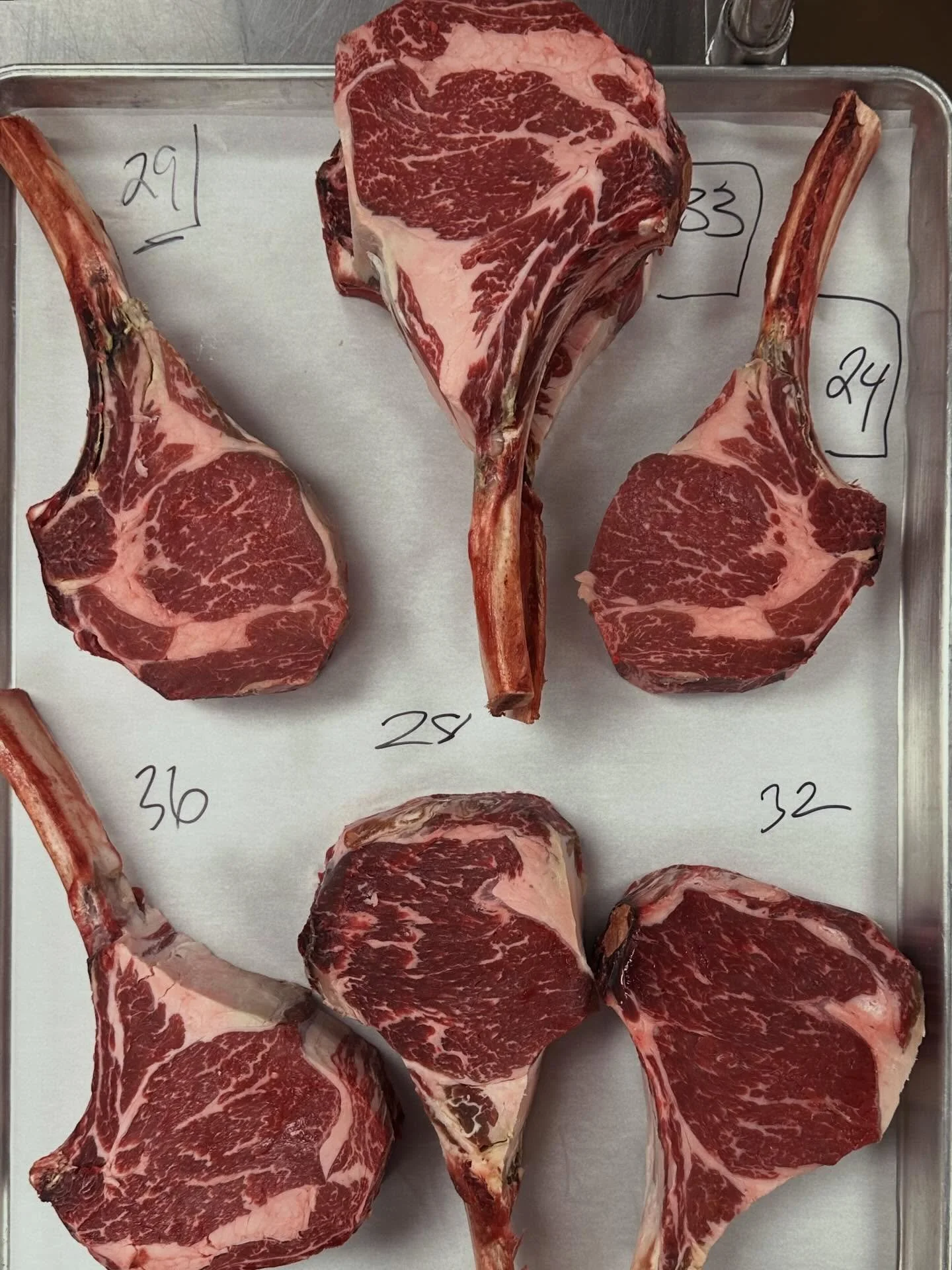 Our USDA Prime tomahawks are dry-aged in house, then hand-butchered with care before they ever reach the grill. It&rsquo;s a patient, intentional process that brings out incredible depth of flavor and honors the quality of the beef every step of the 