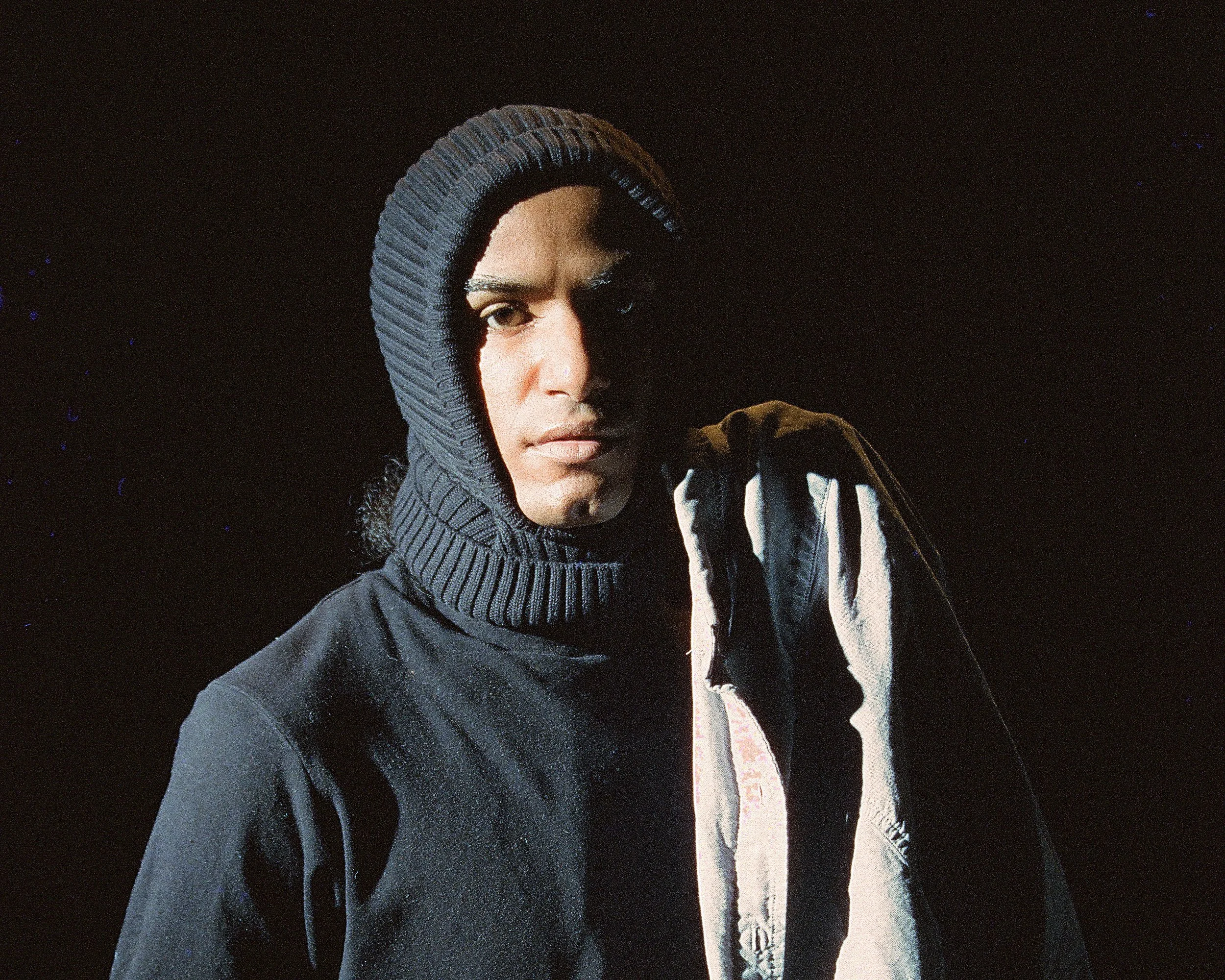 Self portrait of voxgima lo with dramatic lighting shot on digital