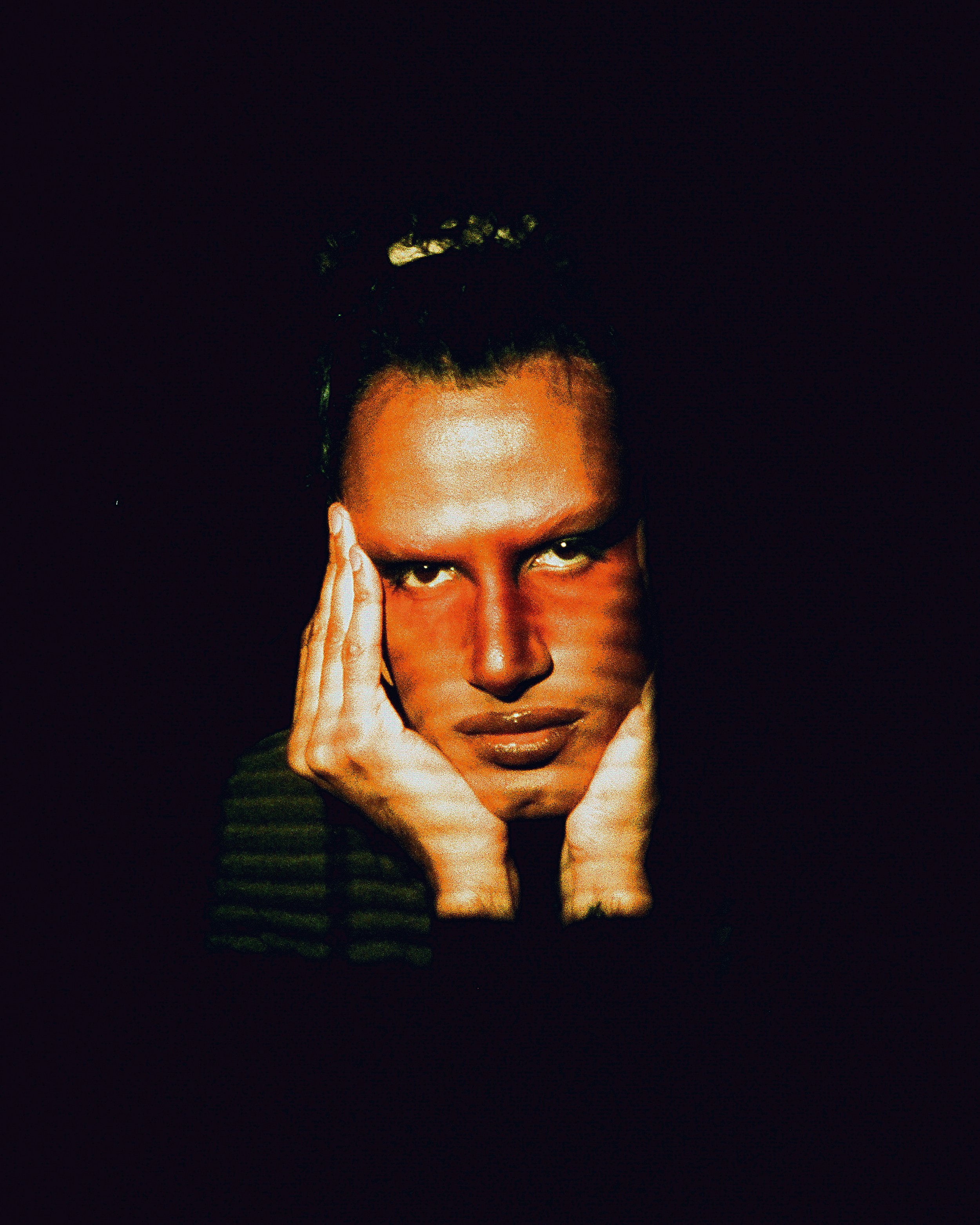 Self portrait of Voxgima Lo with orange lighting shot on digital