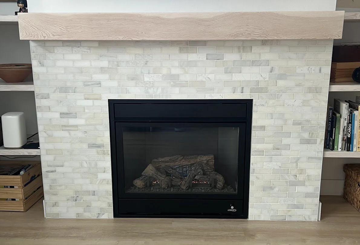 black fireplace professionally installed by Keystone Carpentry in a modern new build house in Squamish
