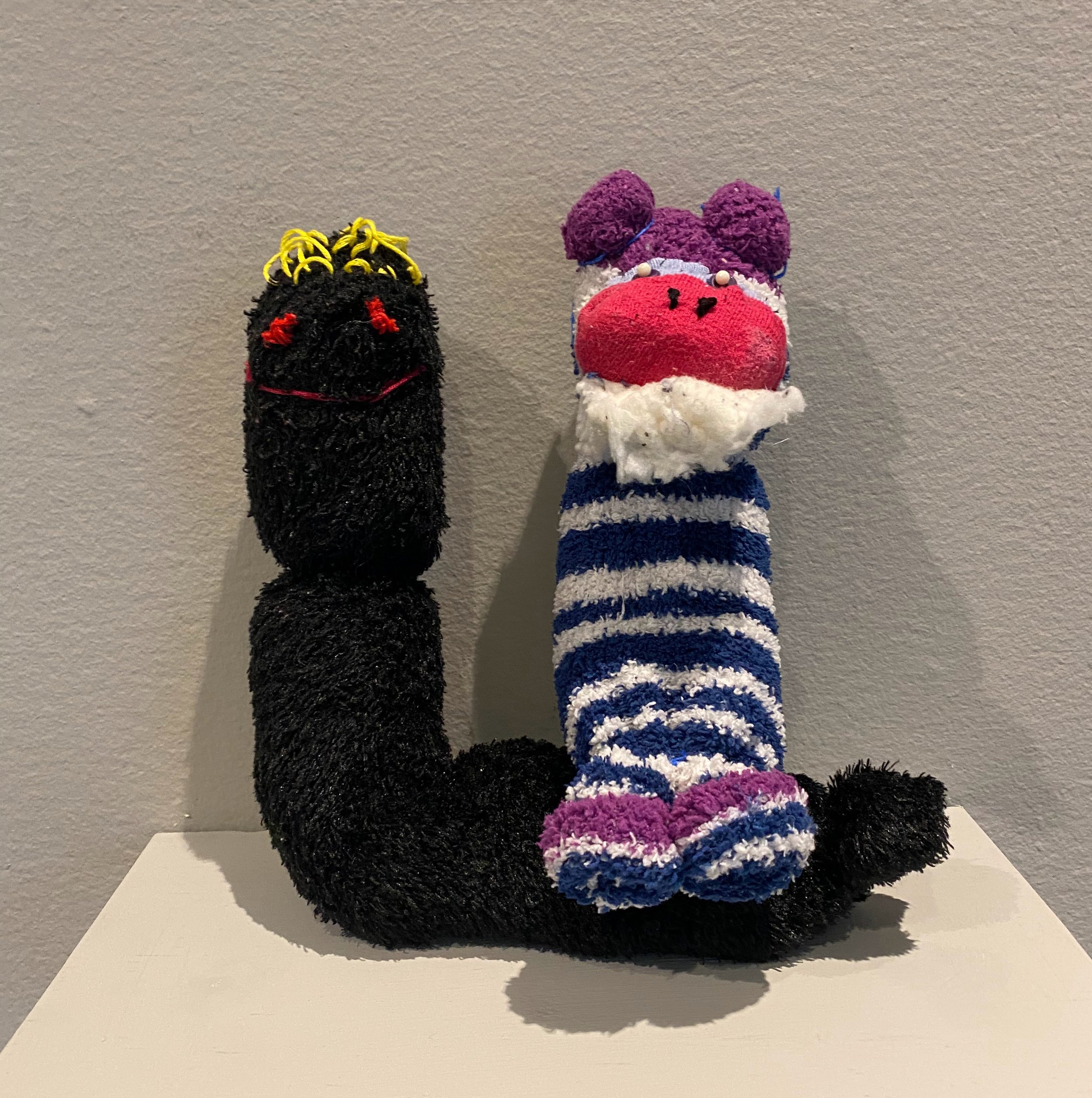 “Best Buds” stuffed puppets made from recycled socks, thread, and other textiles.