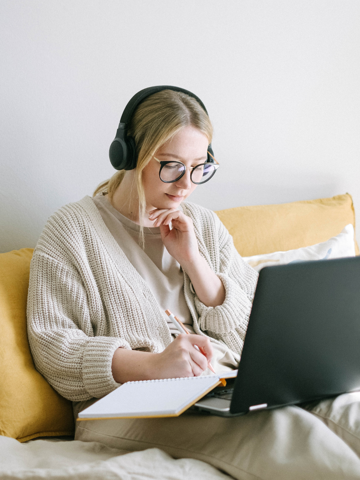 Woman taking the PT clinic weekly business health course at home