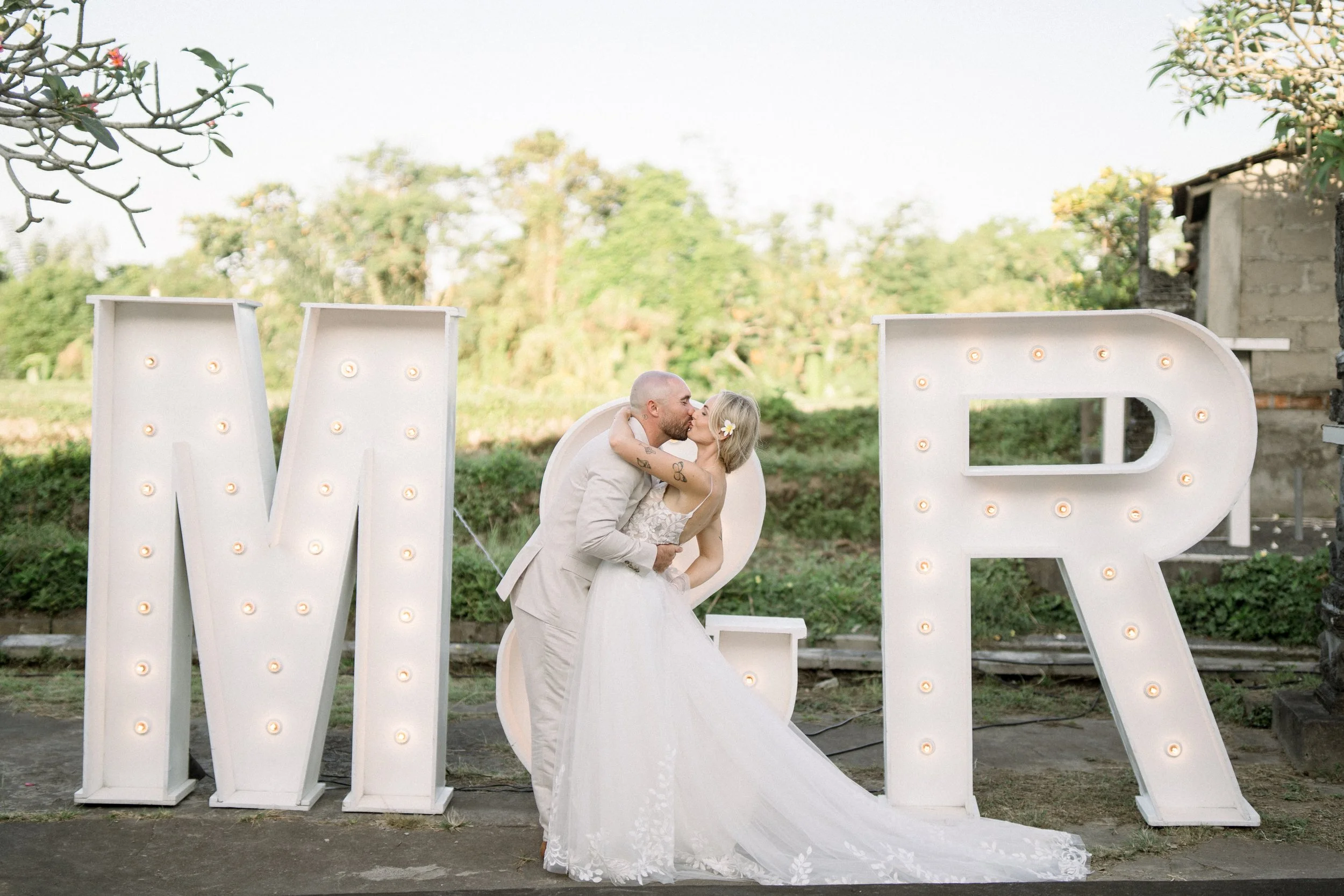 Reani & Matt in front of their sign