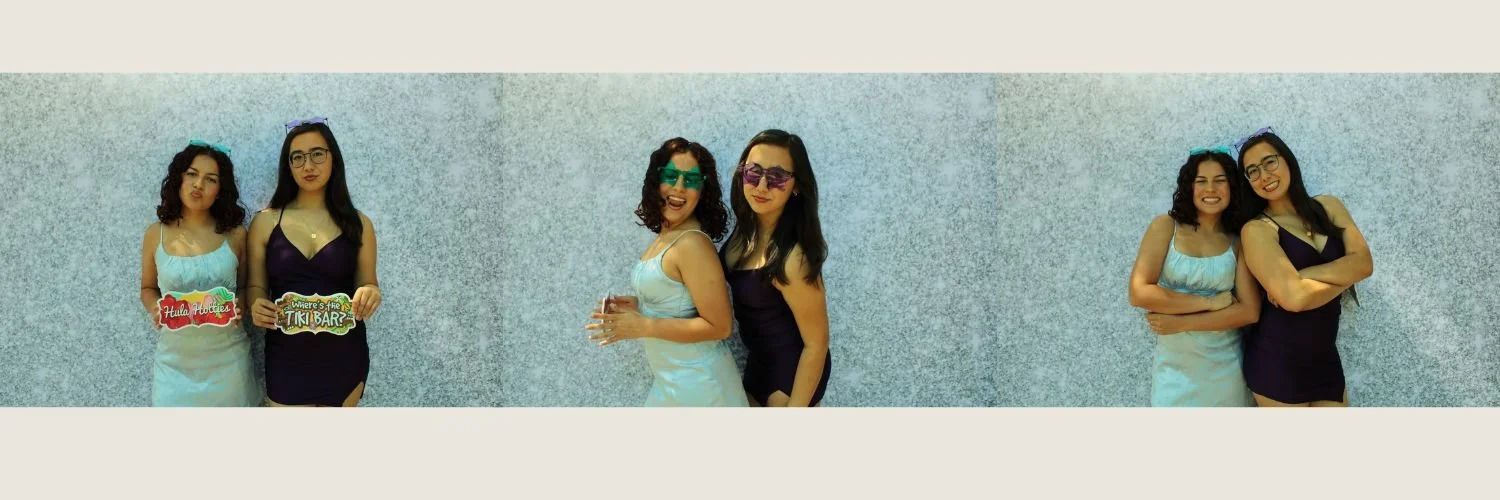 Three women in different poses, wearing dresses and sunglasses, standing against a textured wall.