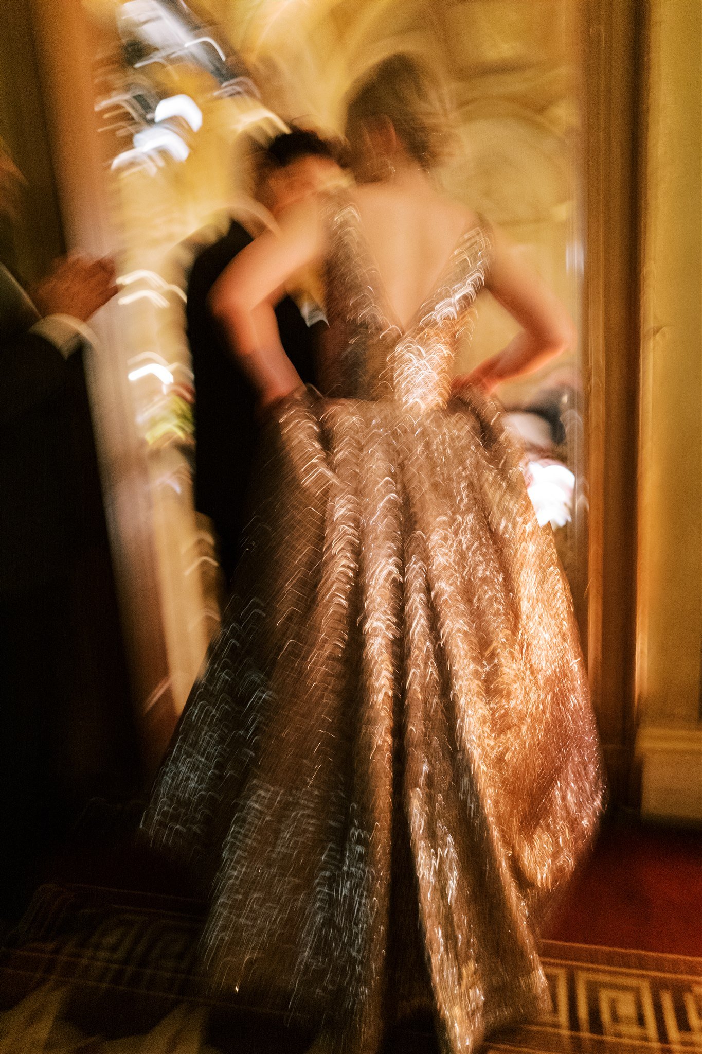 Artistic motion blur of the bride and groom entering the ballroom during the reception. michelle rago destinations wedding planner nyc.