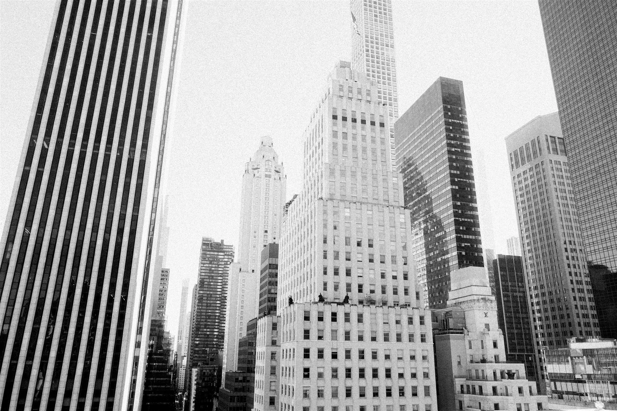 Black‑and‑white skyline view of Midtown skyscrapers. nyc courthouse wedding city hall.