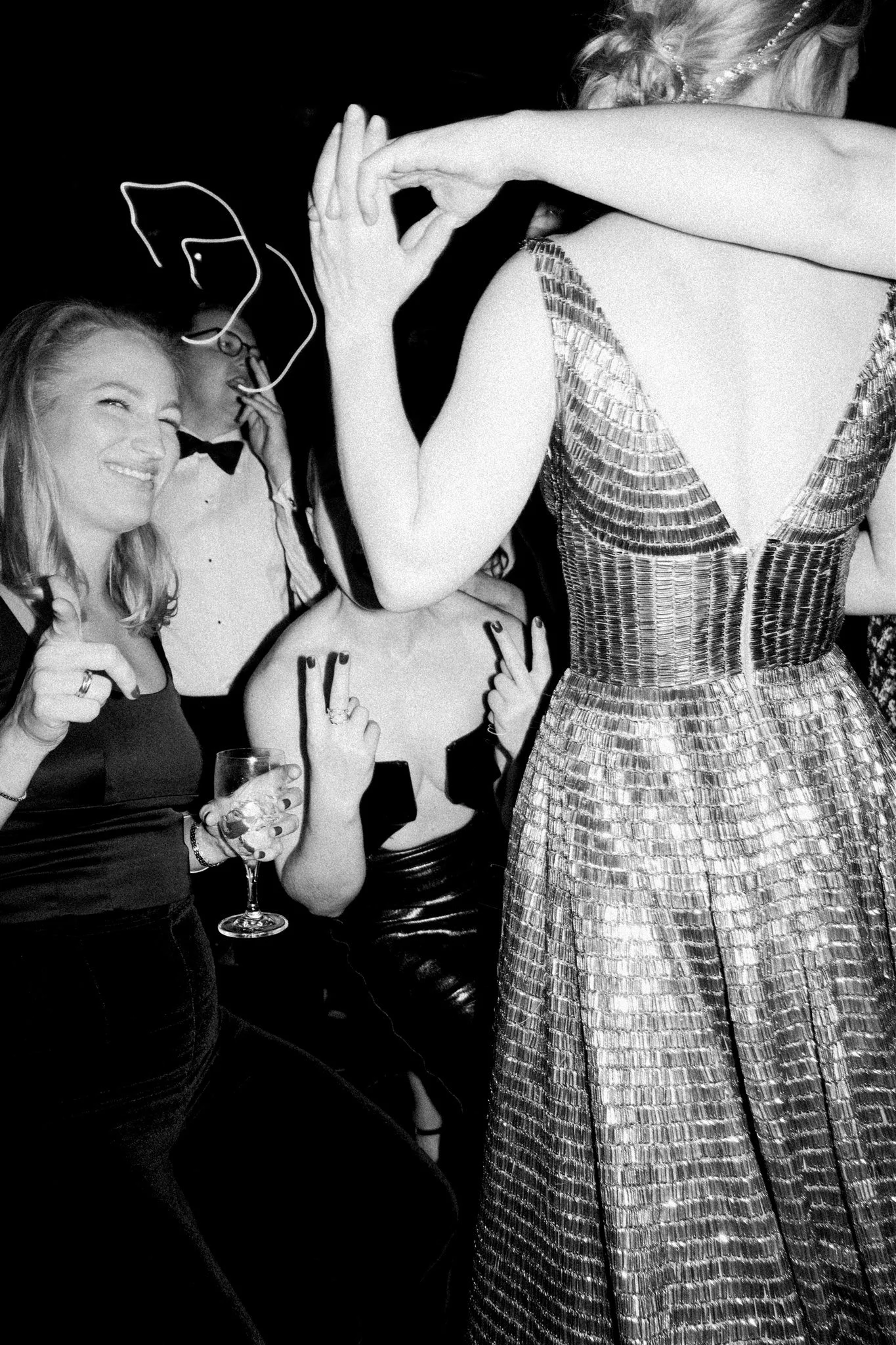 Guests raise their hands on the dance floor as the couple celebrates from the balcony. the plaza hotel nyc luxury wedding.