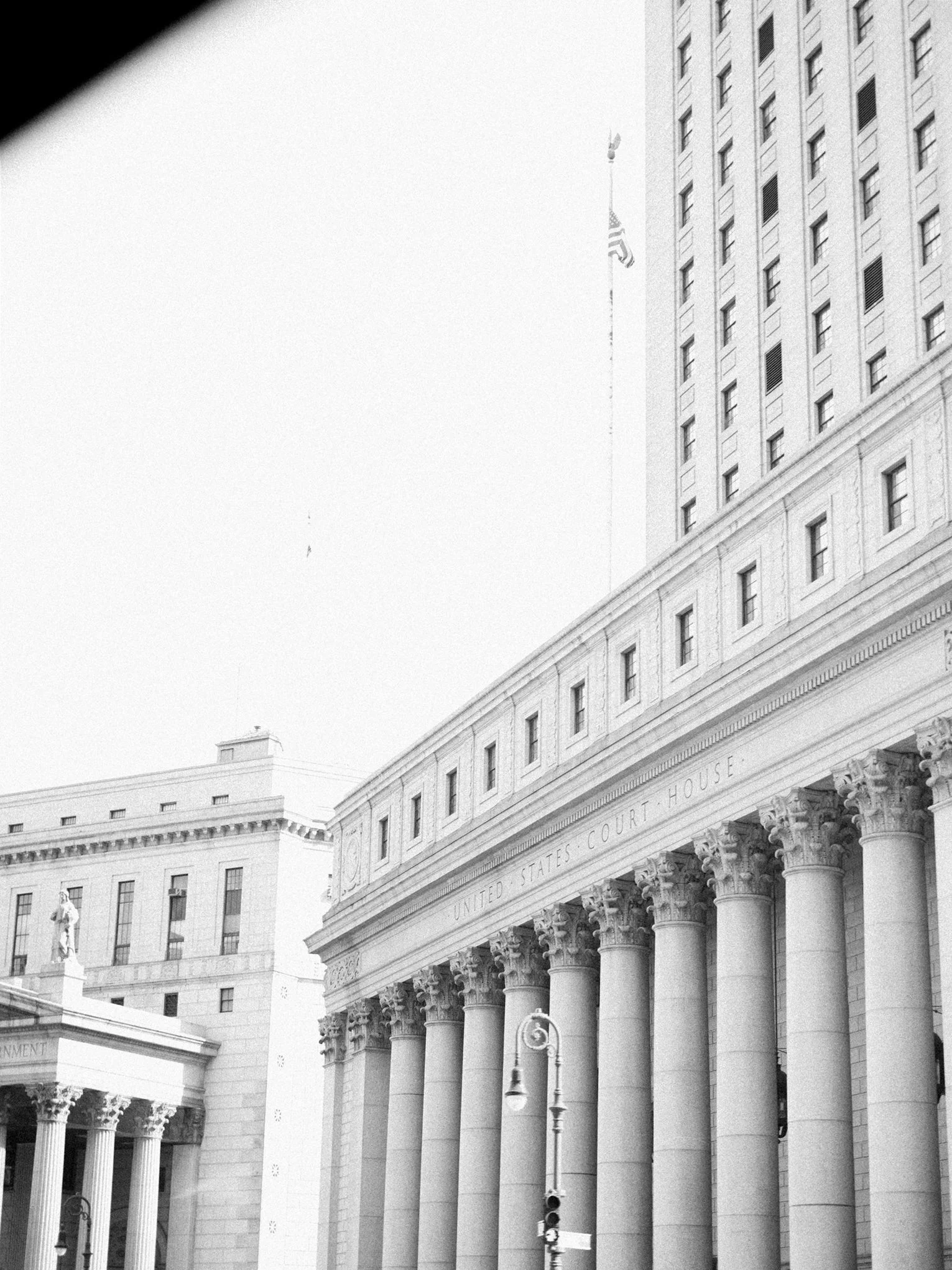 Cityscape with courthouse columns and skyline beyond. the plaza hotel new york luxury wedding.