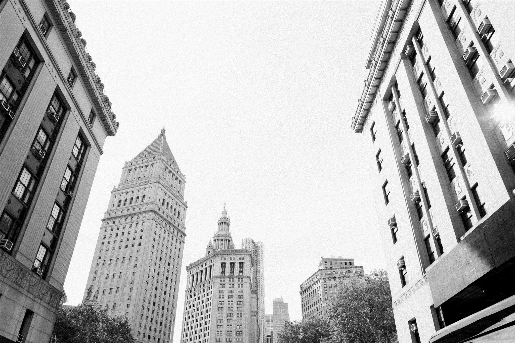 Cityscape with courthouse columns and skyline beyond. the plaza hotel new york luxury wedding.