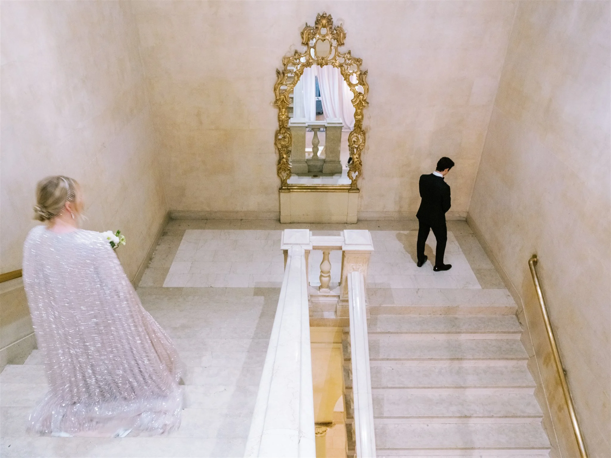 Emotional first look on the grand staircase at The Plaza. the plaza hotel nyc luxury wedding.