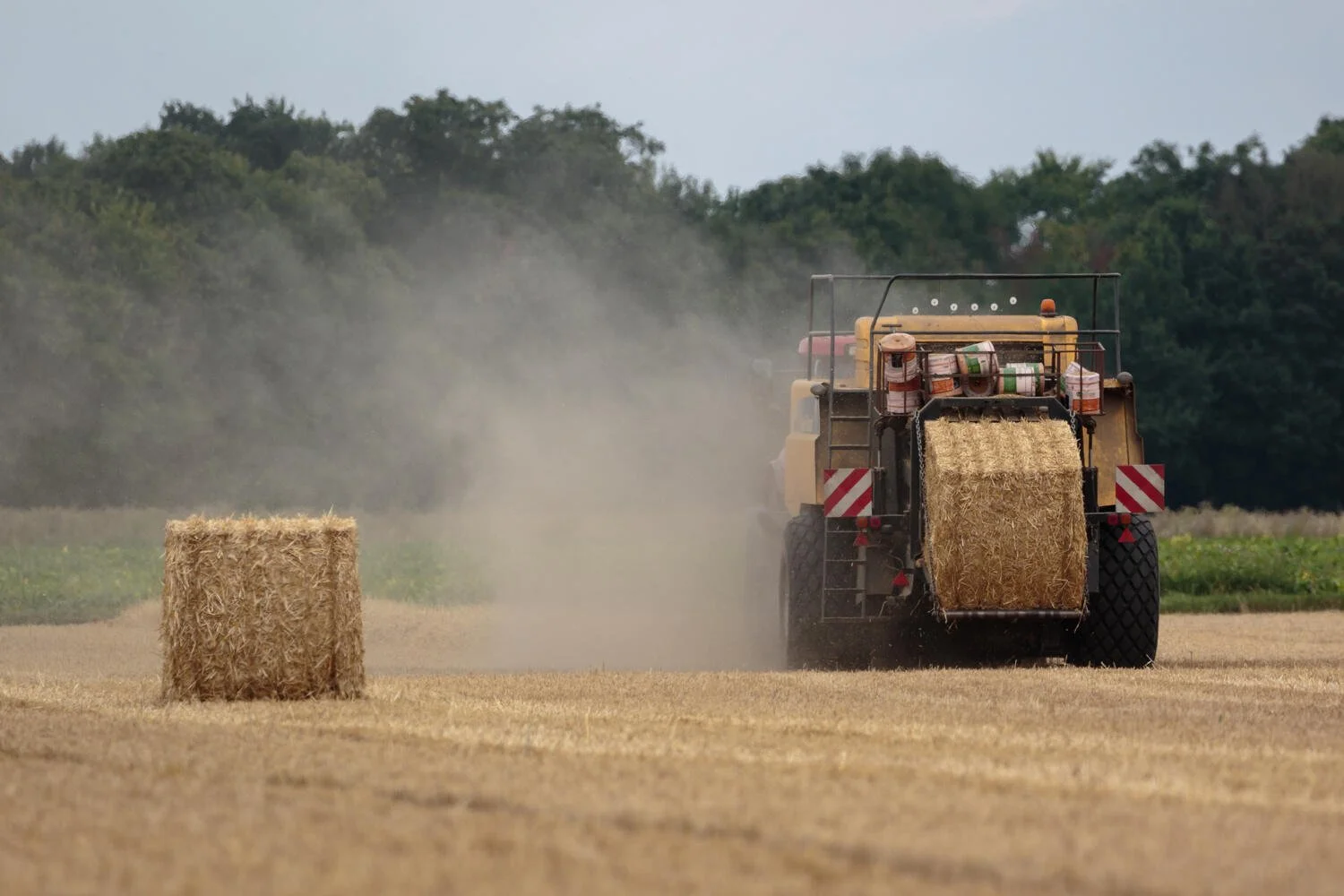 Modern-case-215-tractor-and-a-holland-straw-baler-farming-in-the-Fens 1.jpg