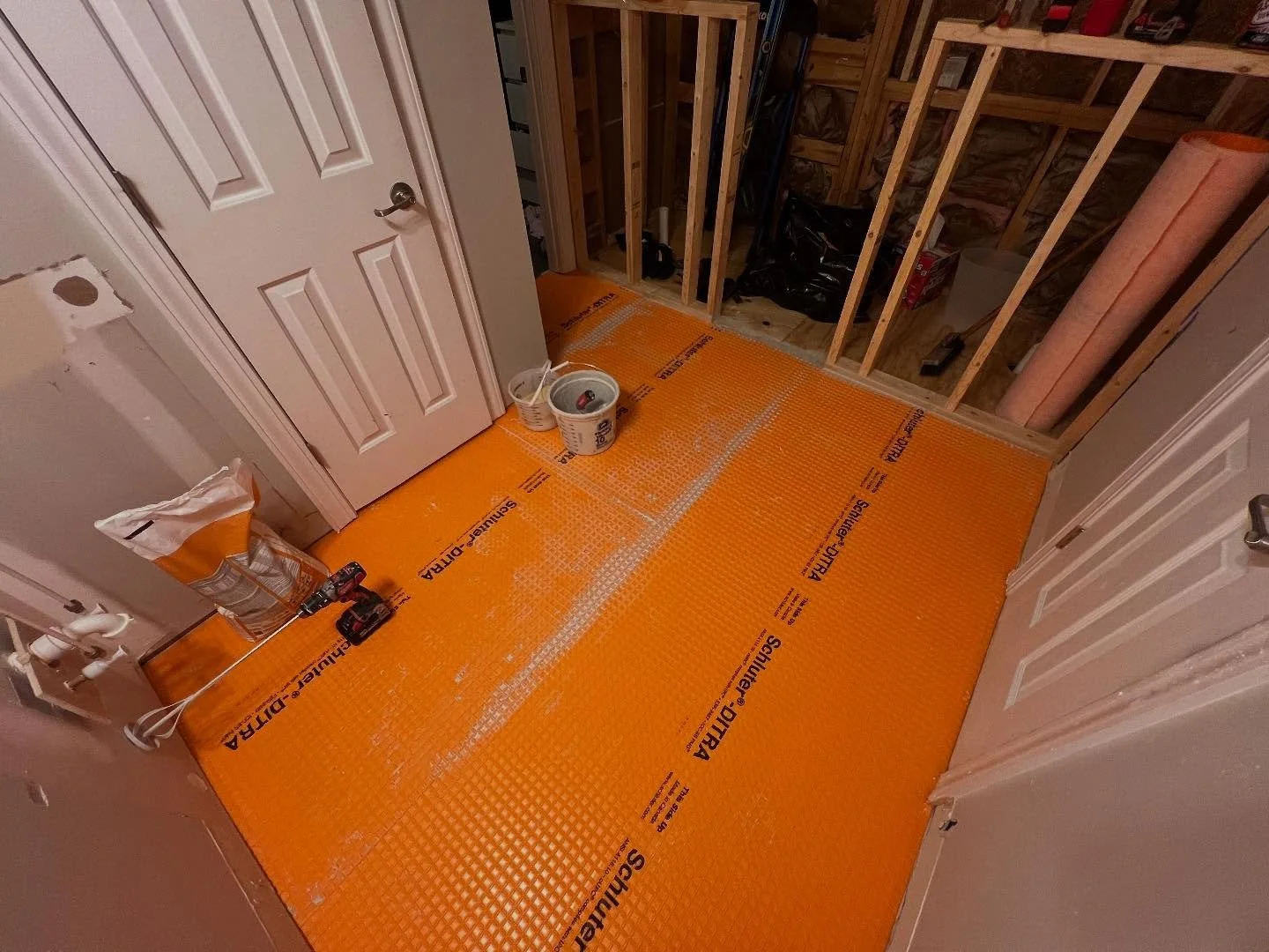 So excited to see that orange go down, means progress. We always prefer using the Schluter-KERDI board system in our bathrooms. It is built-in waterproofing system, so much lighter weight than other options, able to create niches and other designs wi