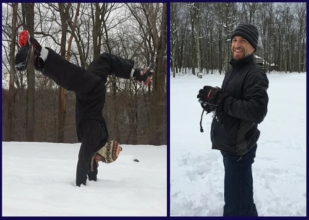 A person doing a handstand in the snow on the left, and a person holding a camera on the right, both outdoors in a snowy forest.