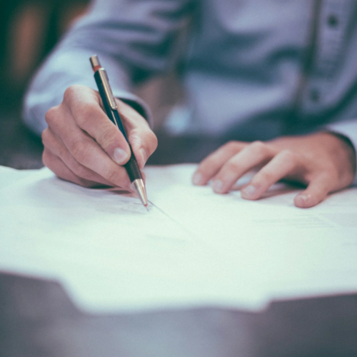 Packaging candidate signing a contract