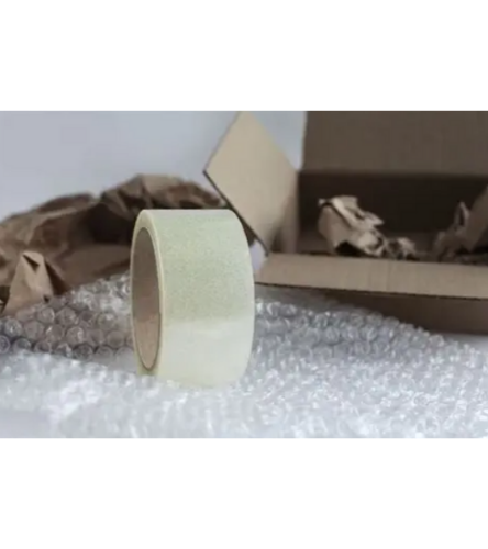 Image of bubble wrap and packaging tape next to a cardboard box