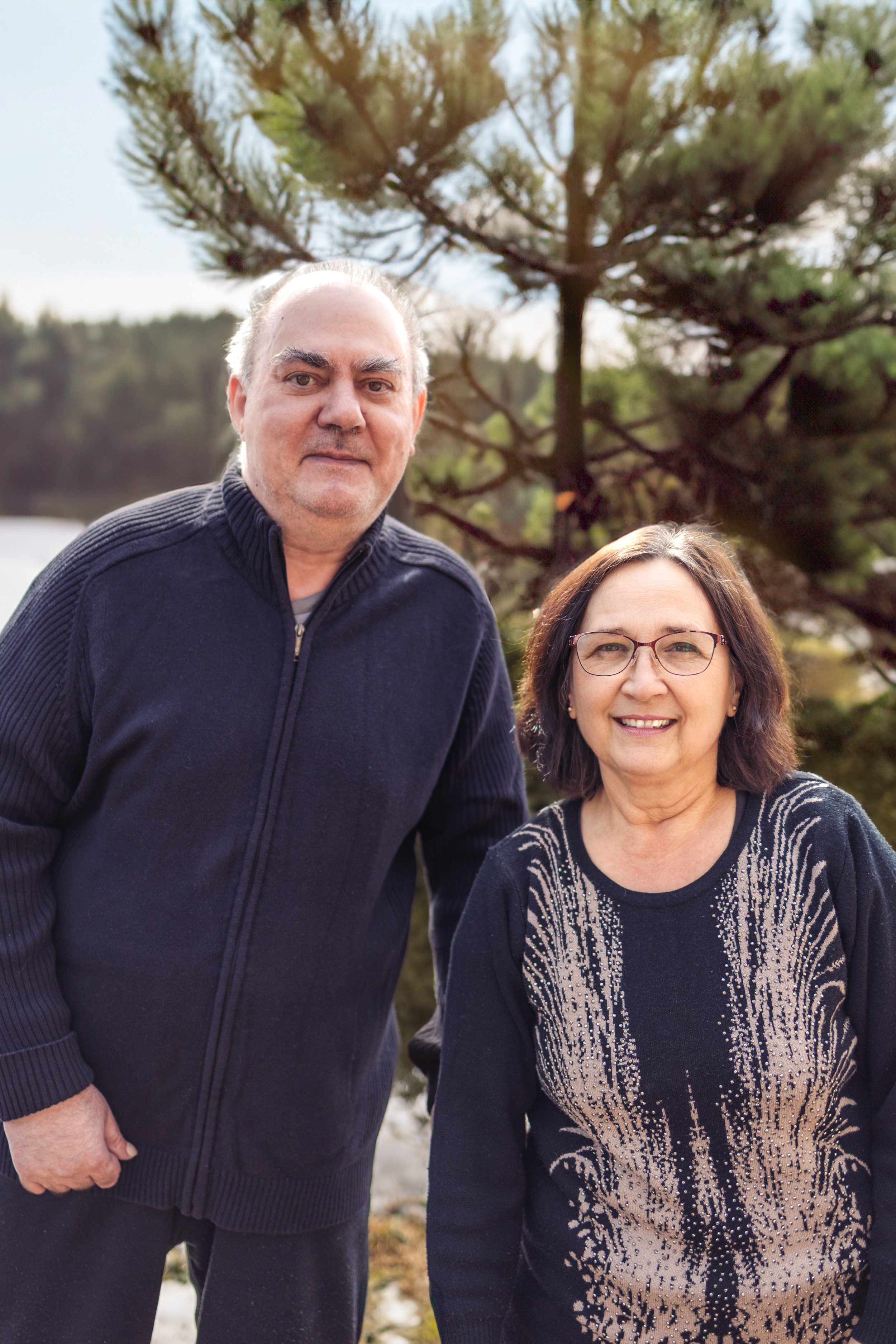 Grandmother and grandfather smiling together outside, Calgary family photography.
