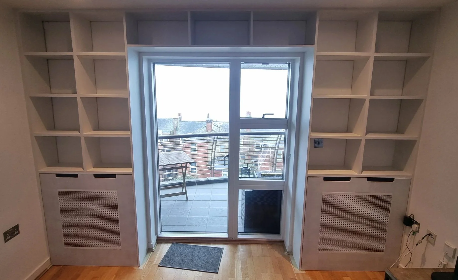 Bespoke+bookshelves+with+radiator+covers.jpg