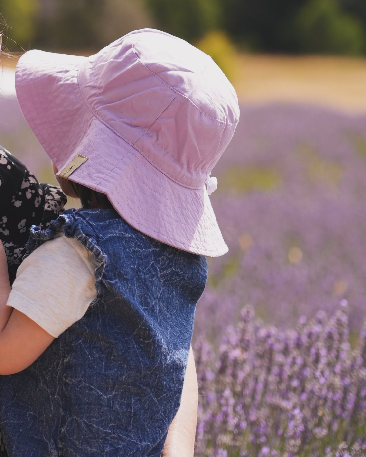 Hattie Buddy sun hat in Lilac Lullaby – a soft lavender shade offering UPF 50+ protection with full neck coverage.