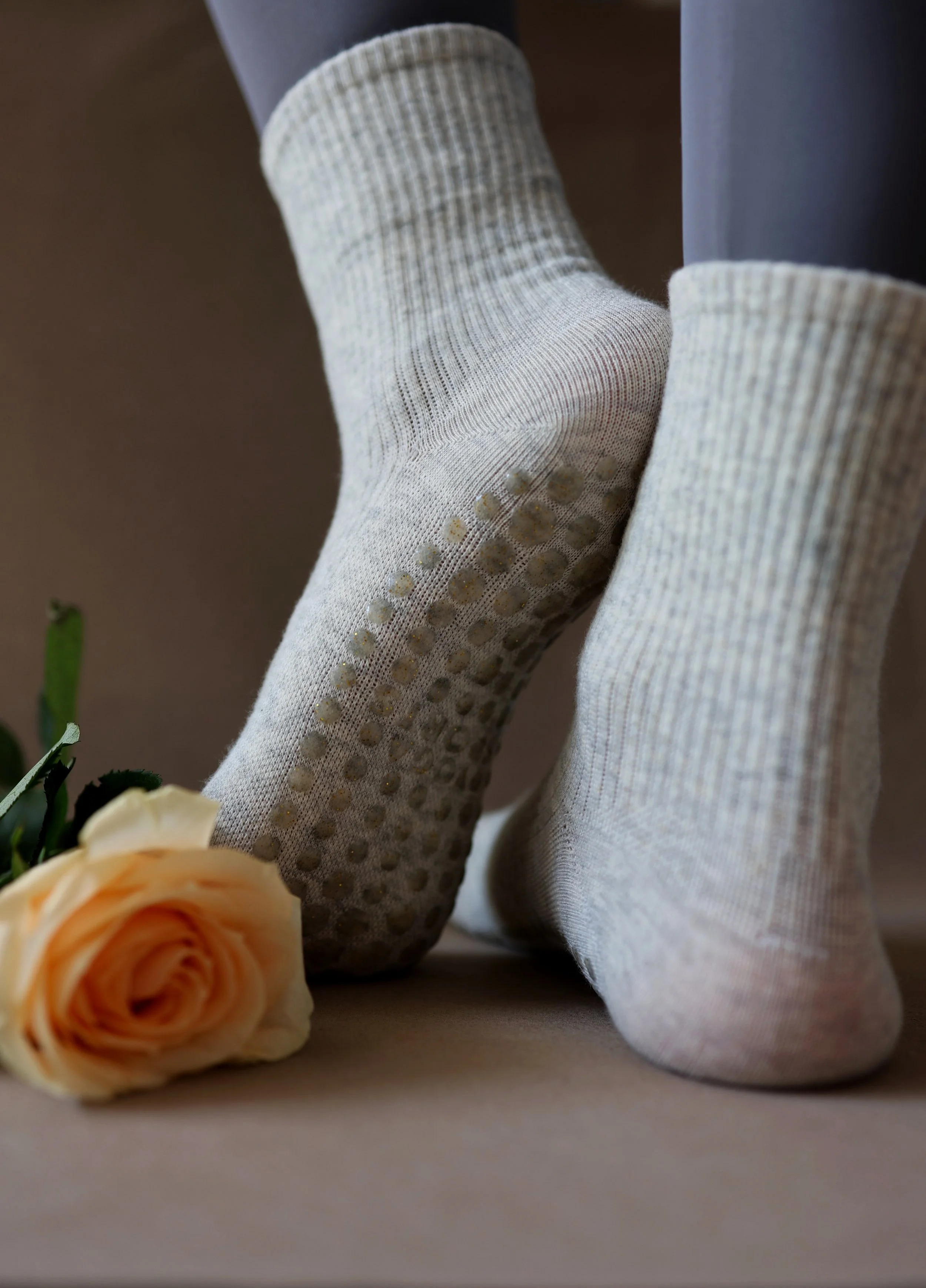Milky grey Pilates socks featuring sparkling silicone grips, made with soft cotton to enhance your serene practice.