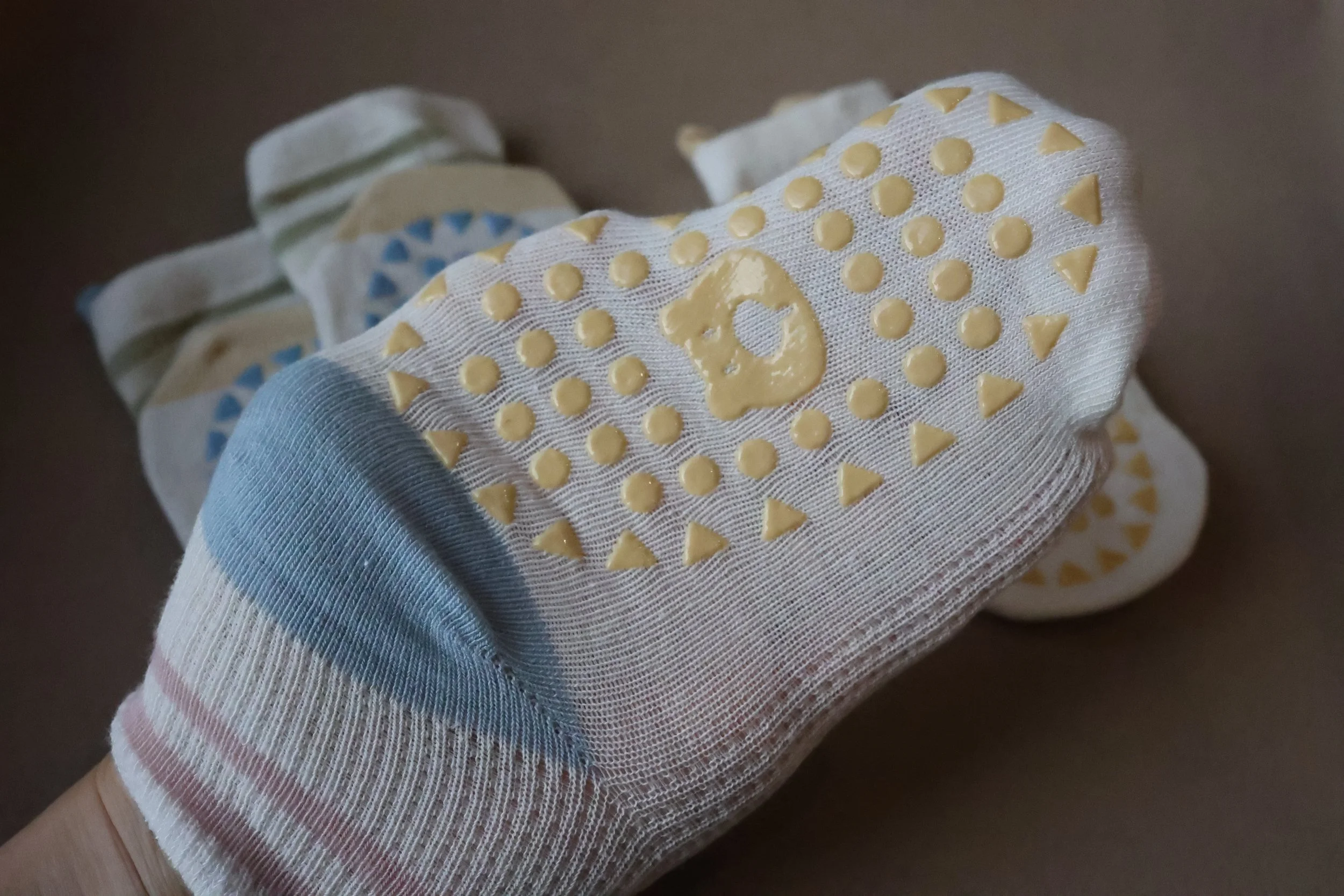 Lightweight baby socks with playful bear ears and colourful silicone grips