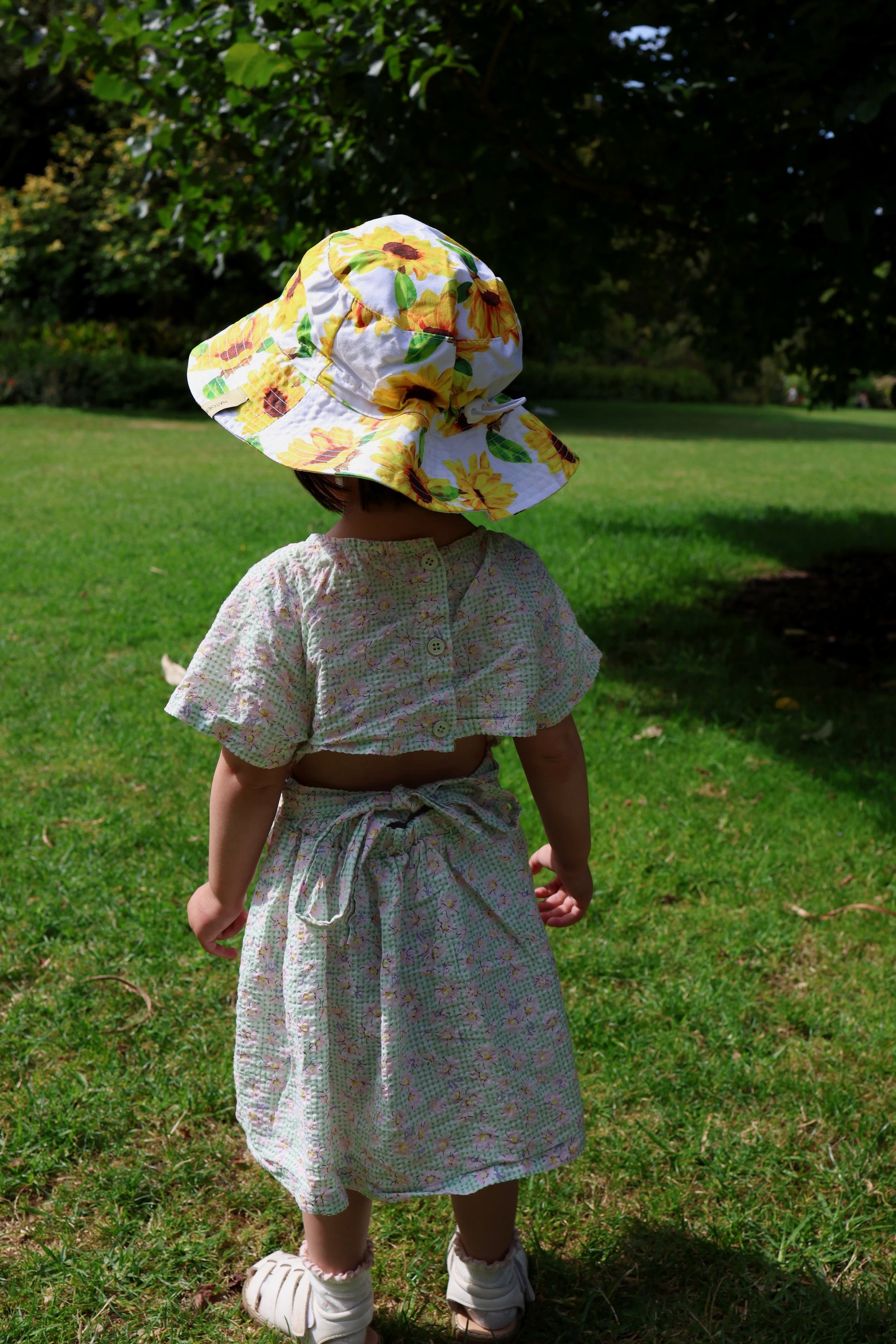 Bloomy Brim hat in Golden Bloom, sunflower prints, and UPF50+ protection.