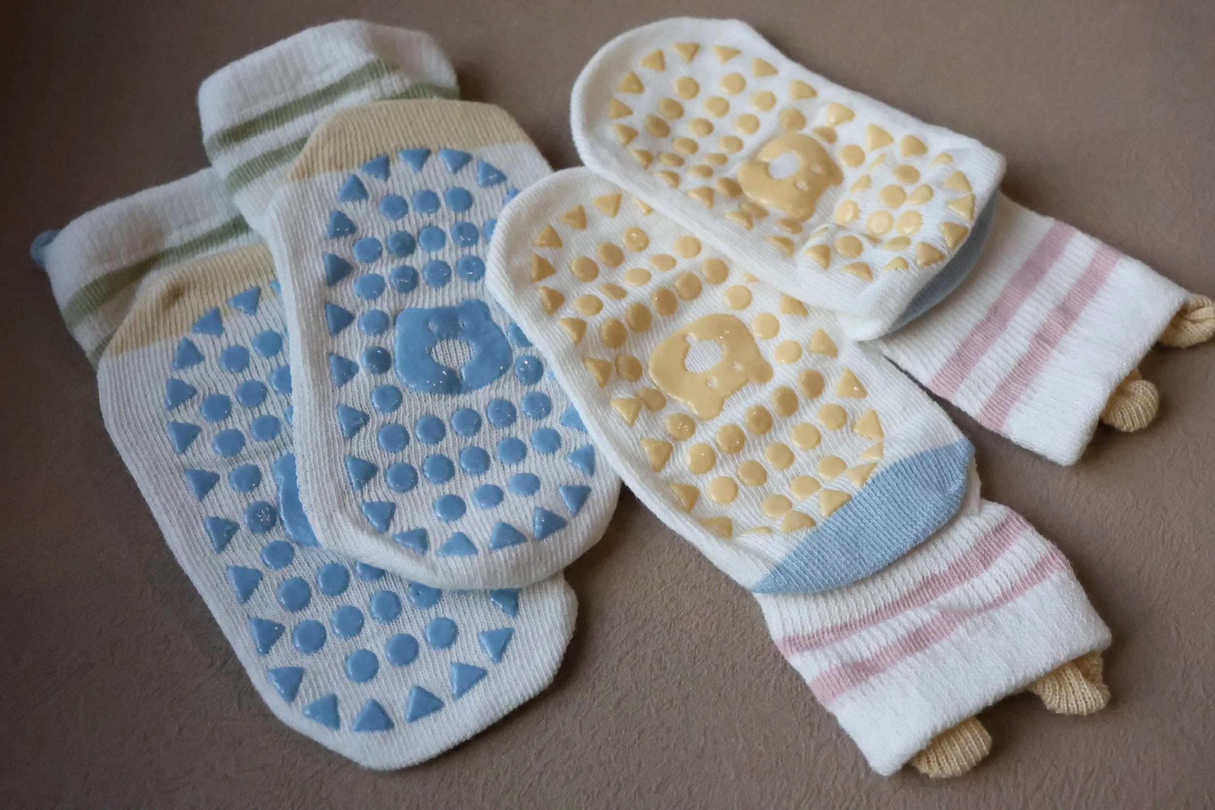 Lightweight baby socks with playful bear ears and colourful silicone grips