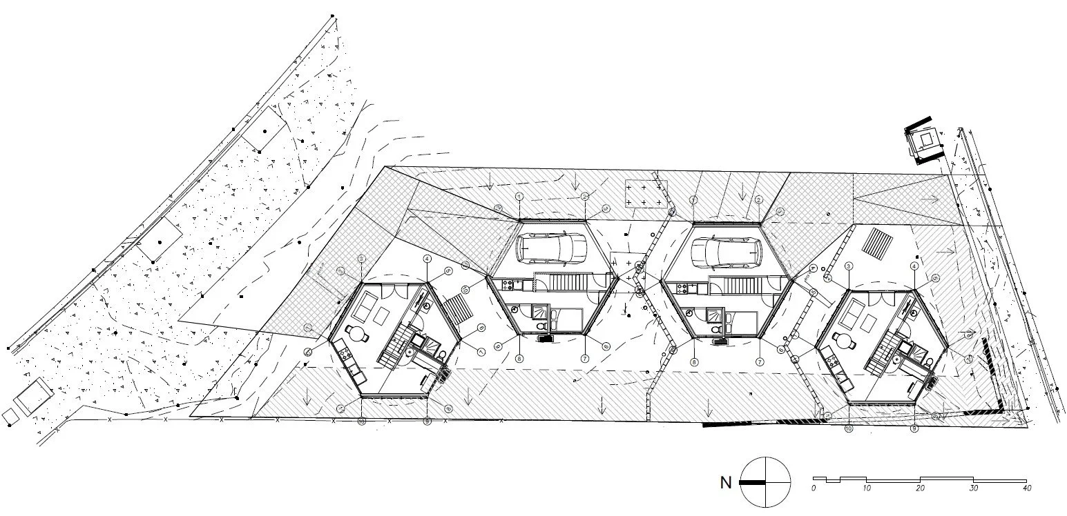 Architectural site plan for a residential complex with three hexagonal units, garages, and landscaping details.